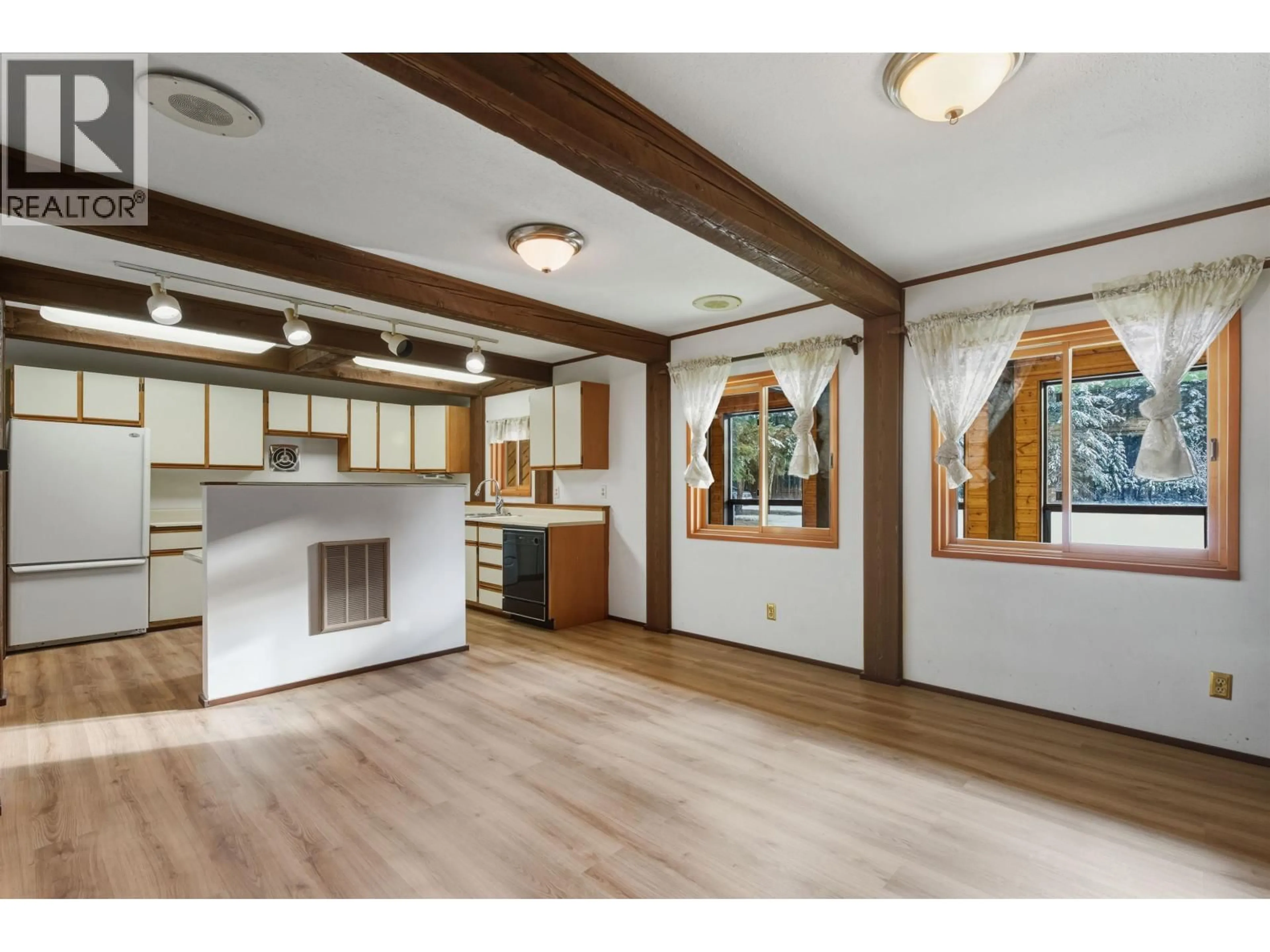 Open concept kitchen, wood/laminate floor for 3339 CRANE ROAD, Williams Lake British Columbia V2G4X4