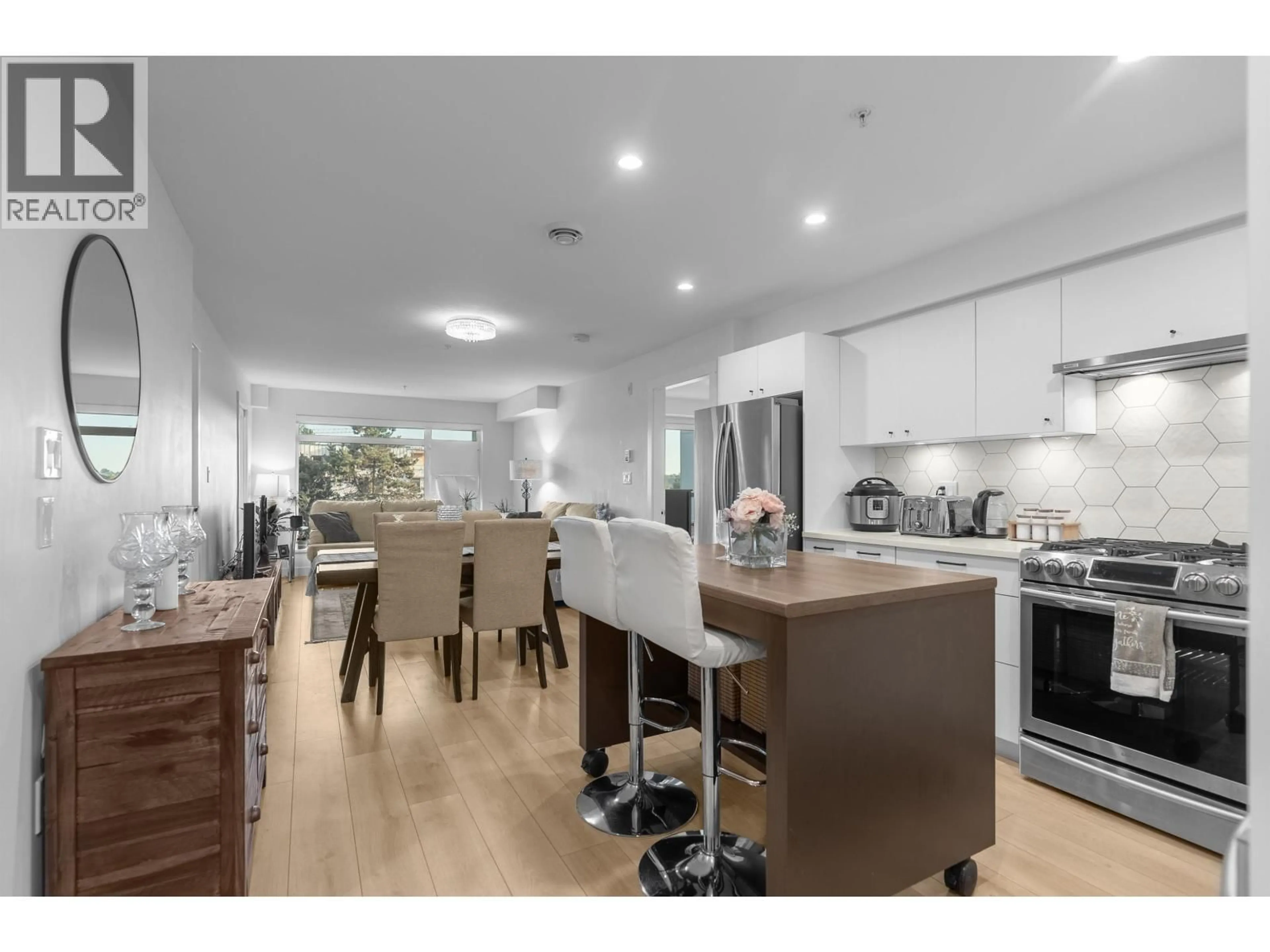 Open concept kitchen, wood/laminate floor for 406 - 1519 CROWN STREET, North Vancouver British Columbia V7J1G6