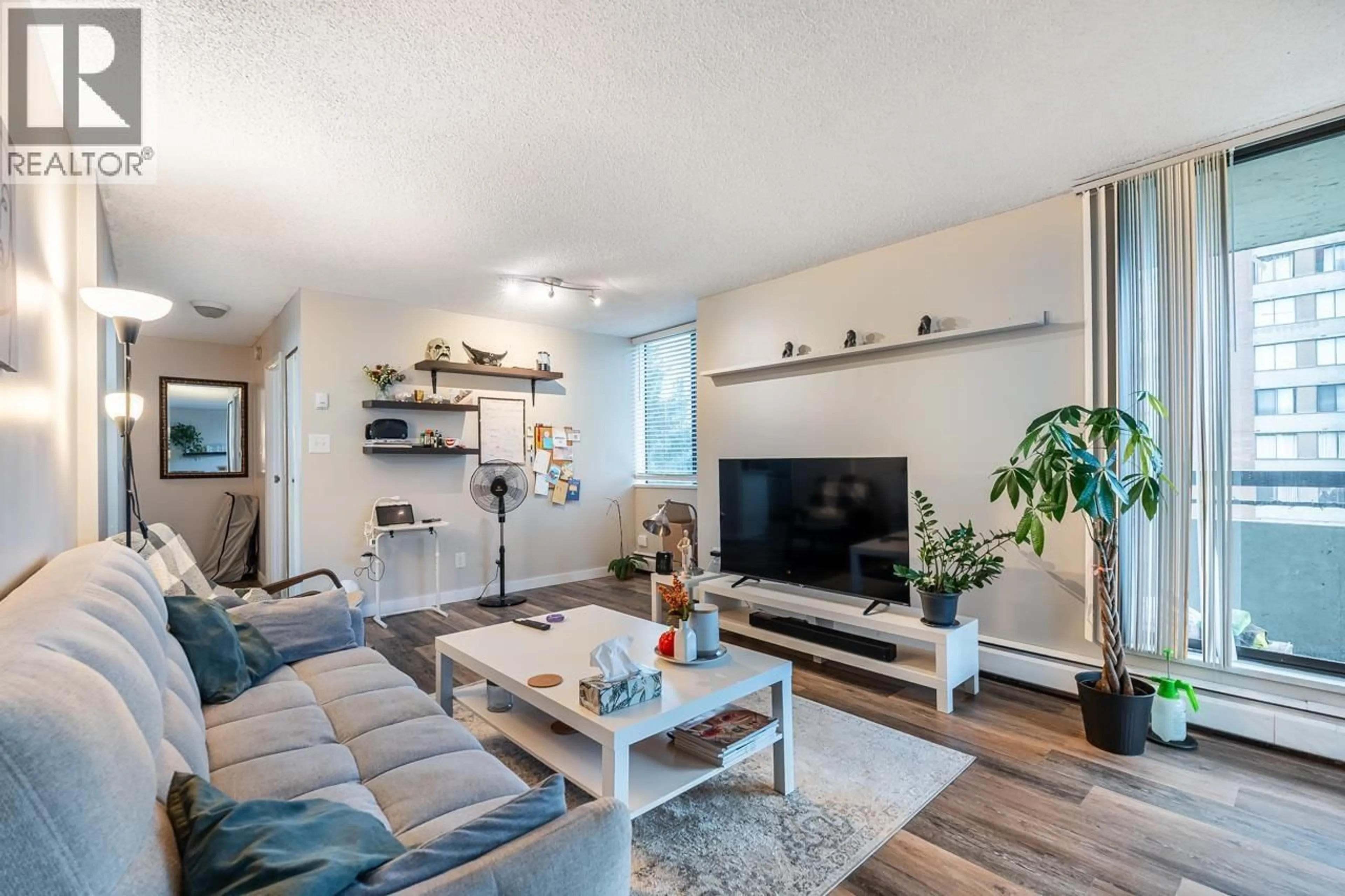 Living room with furniture, wood/laminate floor for 702 - 3755 BARTLETT COURT, Burnaby British Columbia V3J7G7