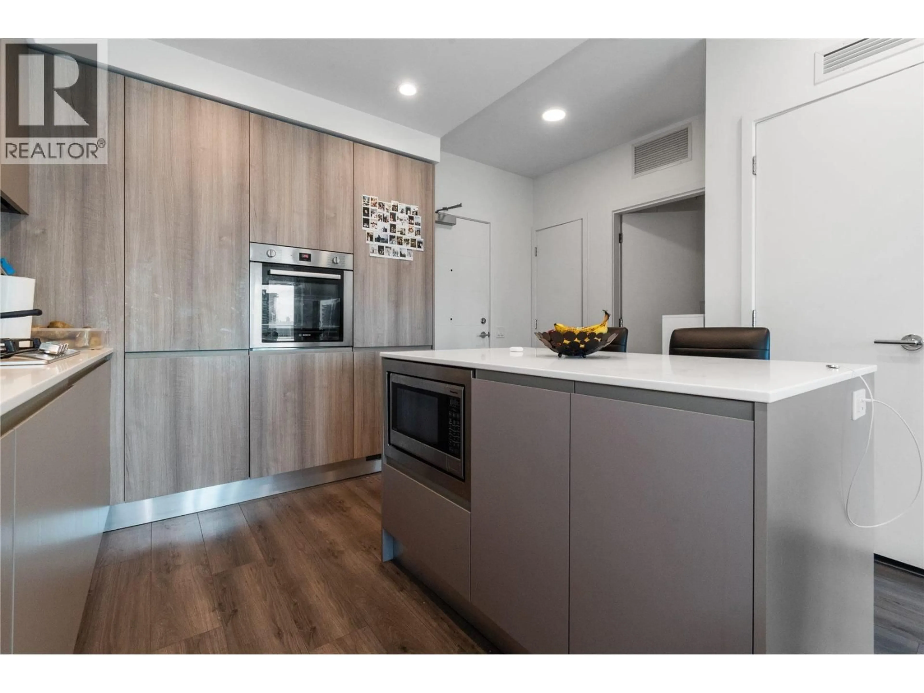 Contemporary kitchen, wood/laminate floor for 609 - 3833 EVERGREEN PLACE, Burnaby British Columbia V3J0M2