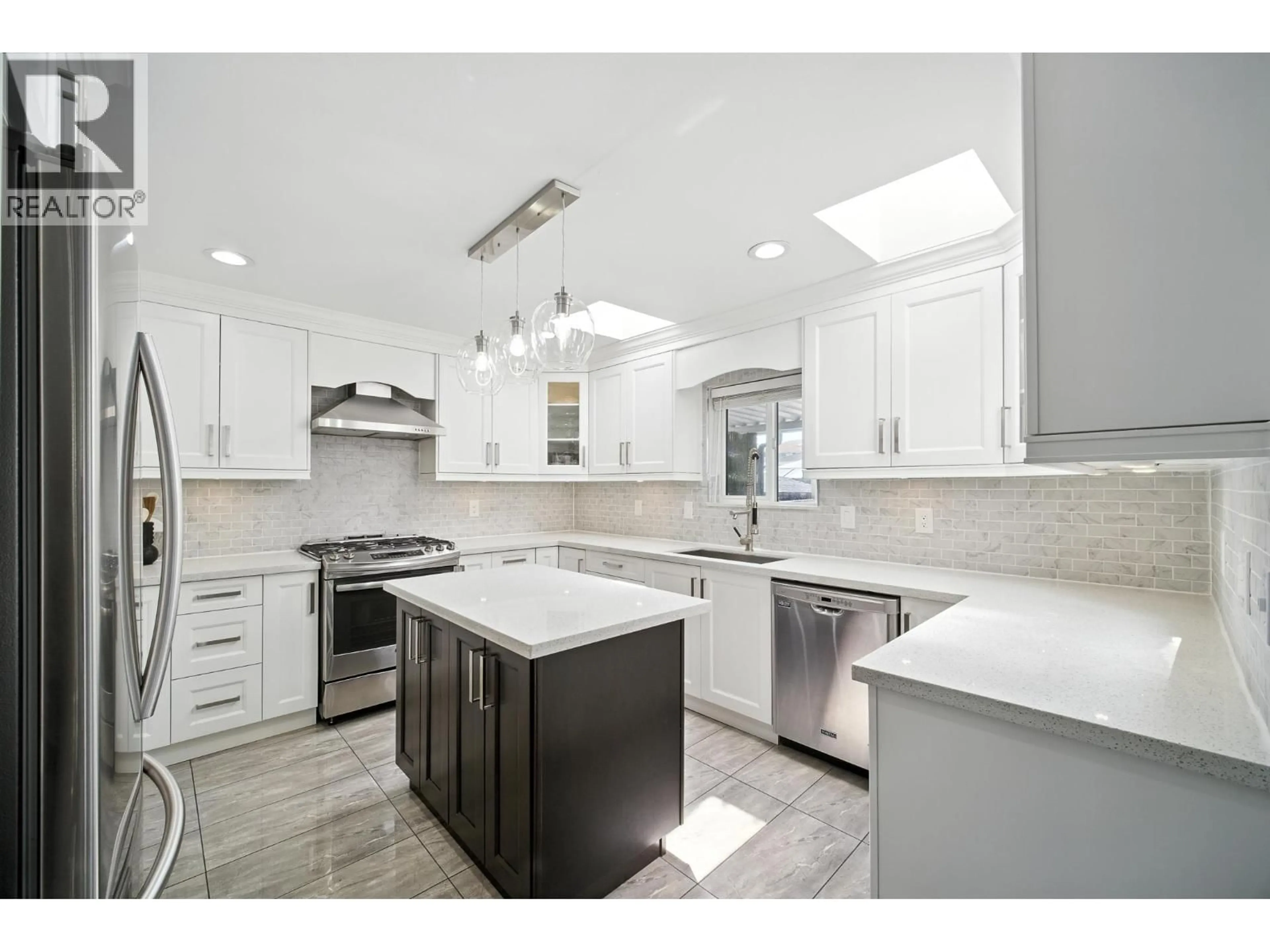 Open concept kitchen, ceramic/tile floor for 7563 1ST STREET, Burnaby British Columbia V3N3T3