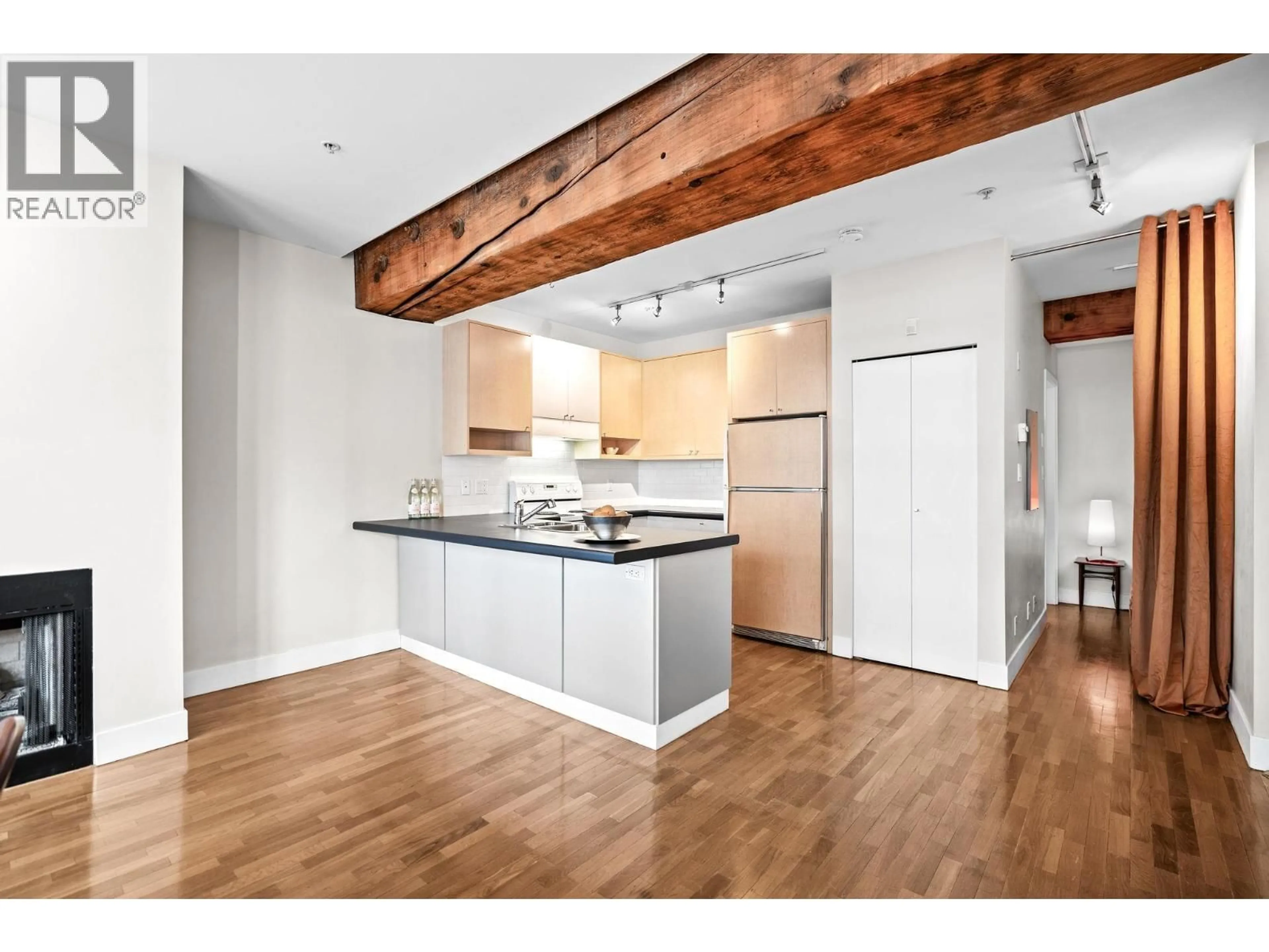 Open concept kitchen, wood/laminate floor for 201 - 869 BEATTY STREET, Vancouver British Columbia V6B2M6