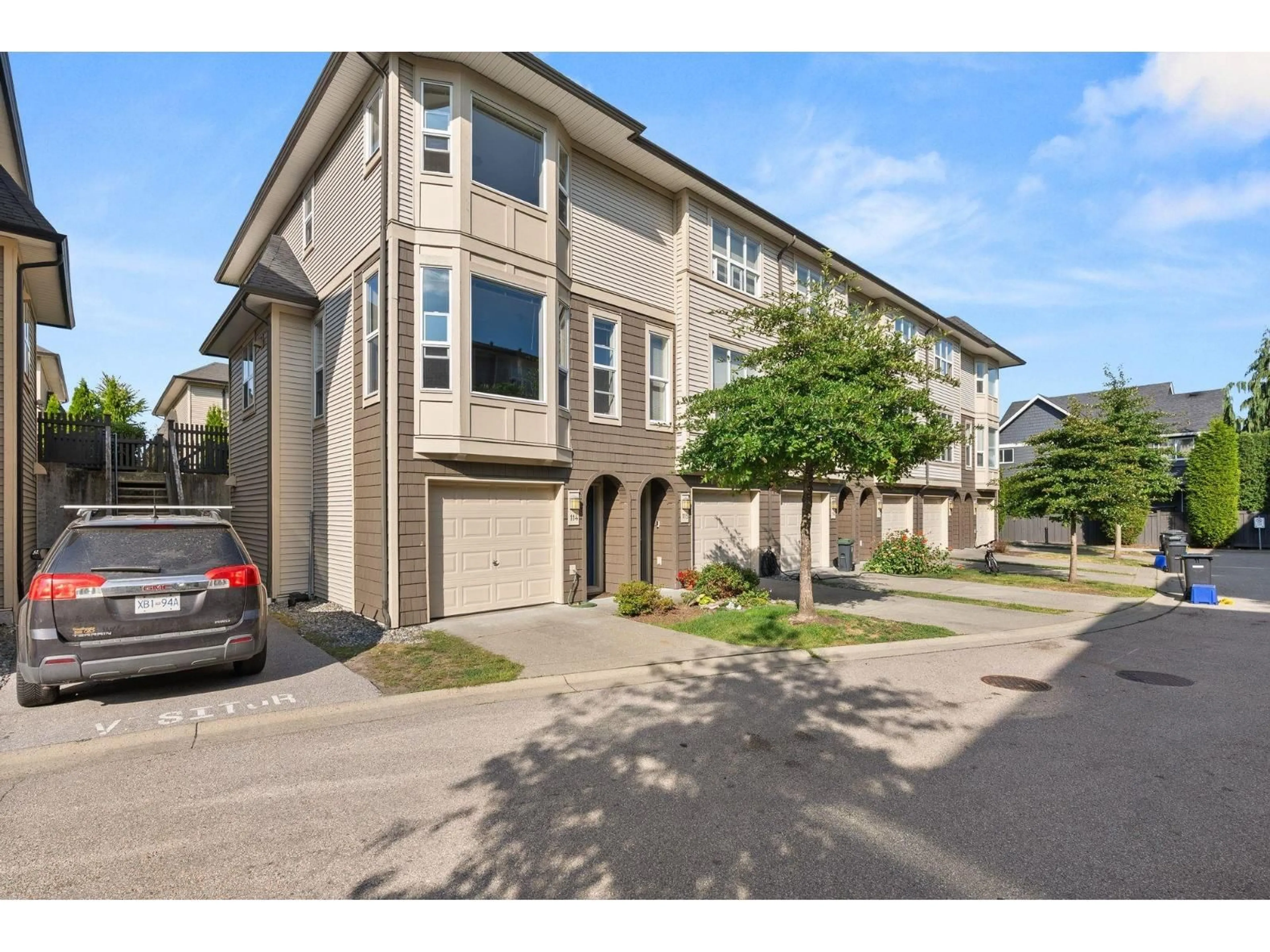 A pic from outside/outdoor area/front of a property/back of a property/a pic from drone, street for 114 - 7938 209 STREET, Langley British Columbia V2Y0J7