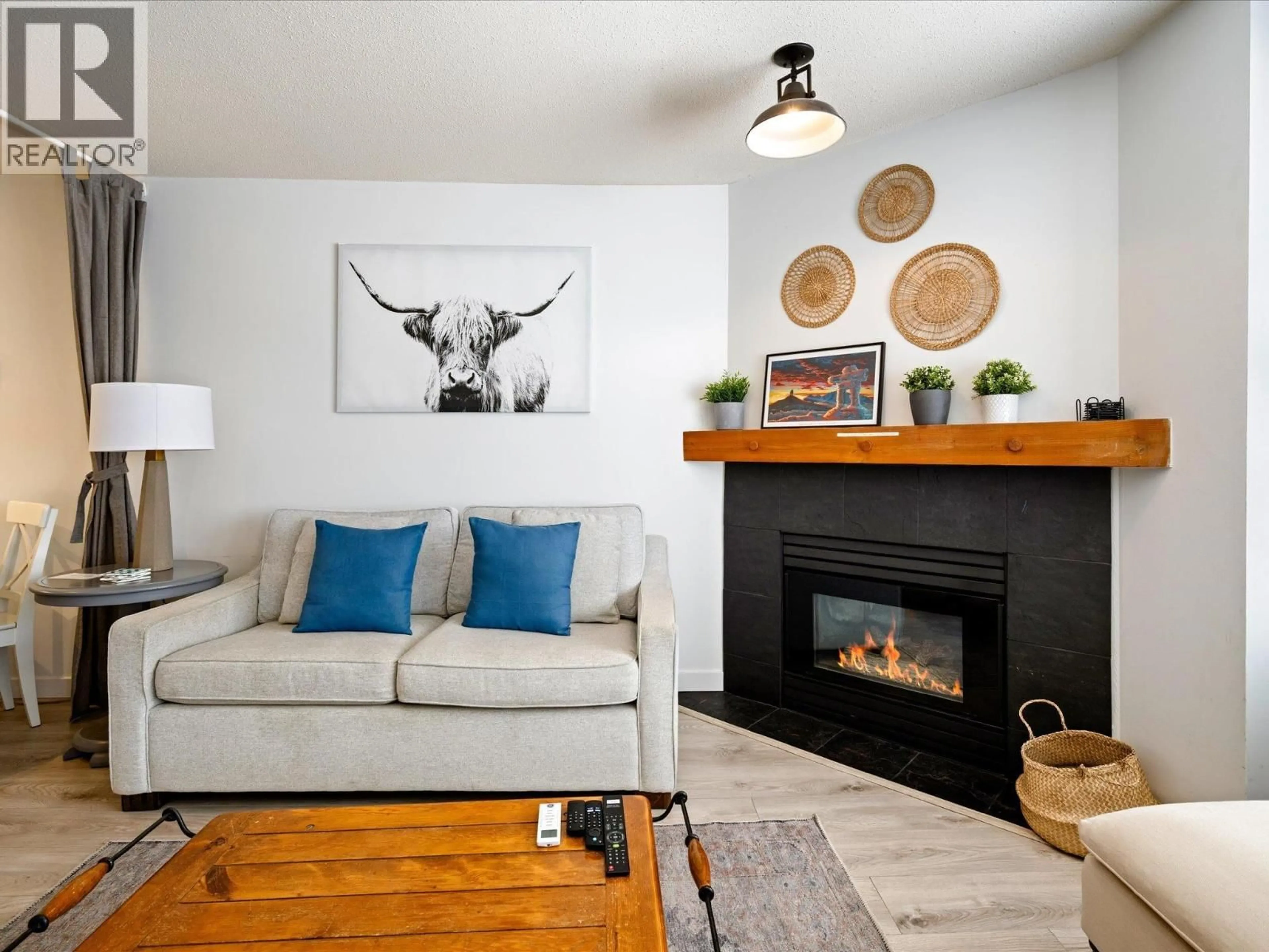 Living room with furniture, wood/laminate floor for 253 - 4340 LORIMER ROAD, Whistler British Columbia V8E1A5