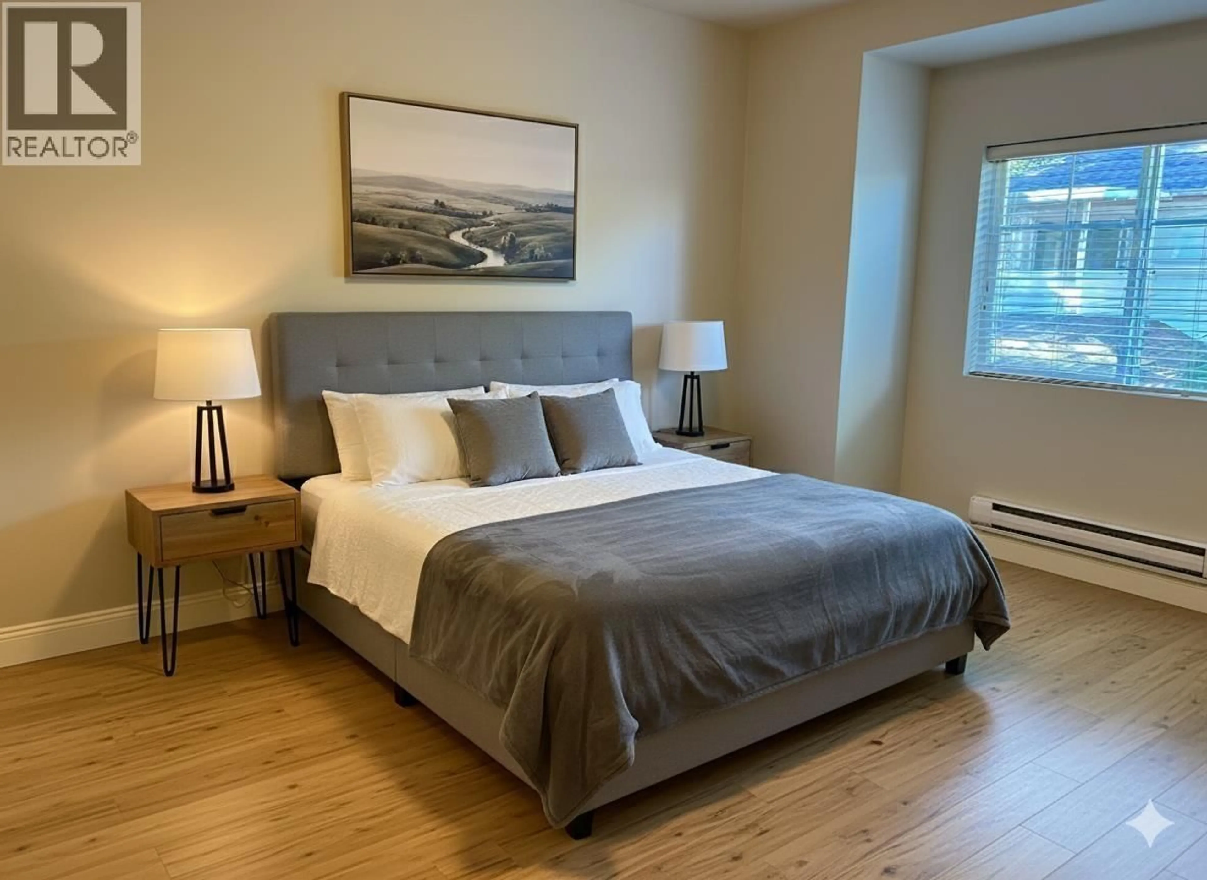 Bedroom with bed, wood/laminate floor for 215 - 22150 DEWDNEY TRUNK ROAD, Maple Ridge British Columbia V2X3H6