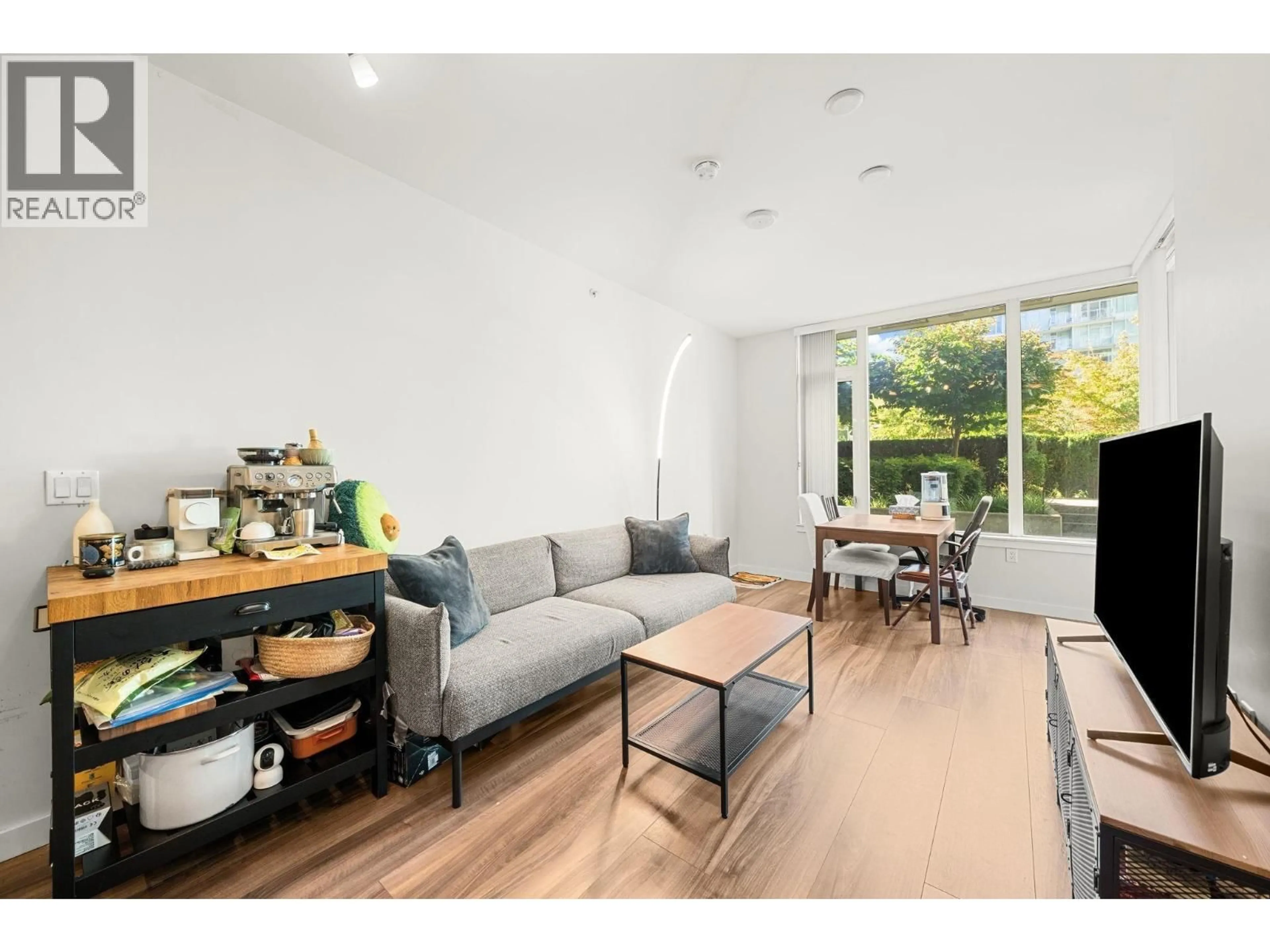 Living room with furniture, wood/laminate floor for 502 - 3333 SEXSMITH ROAD, Richmond British Columbia V6X0R7