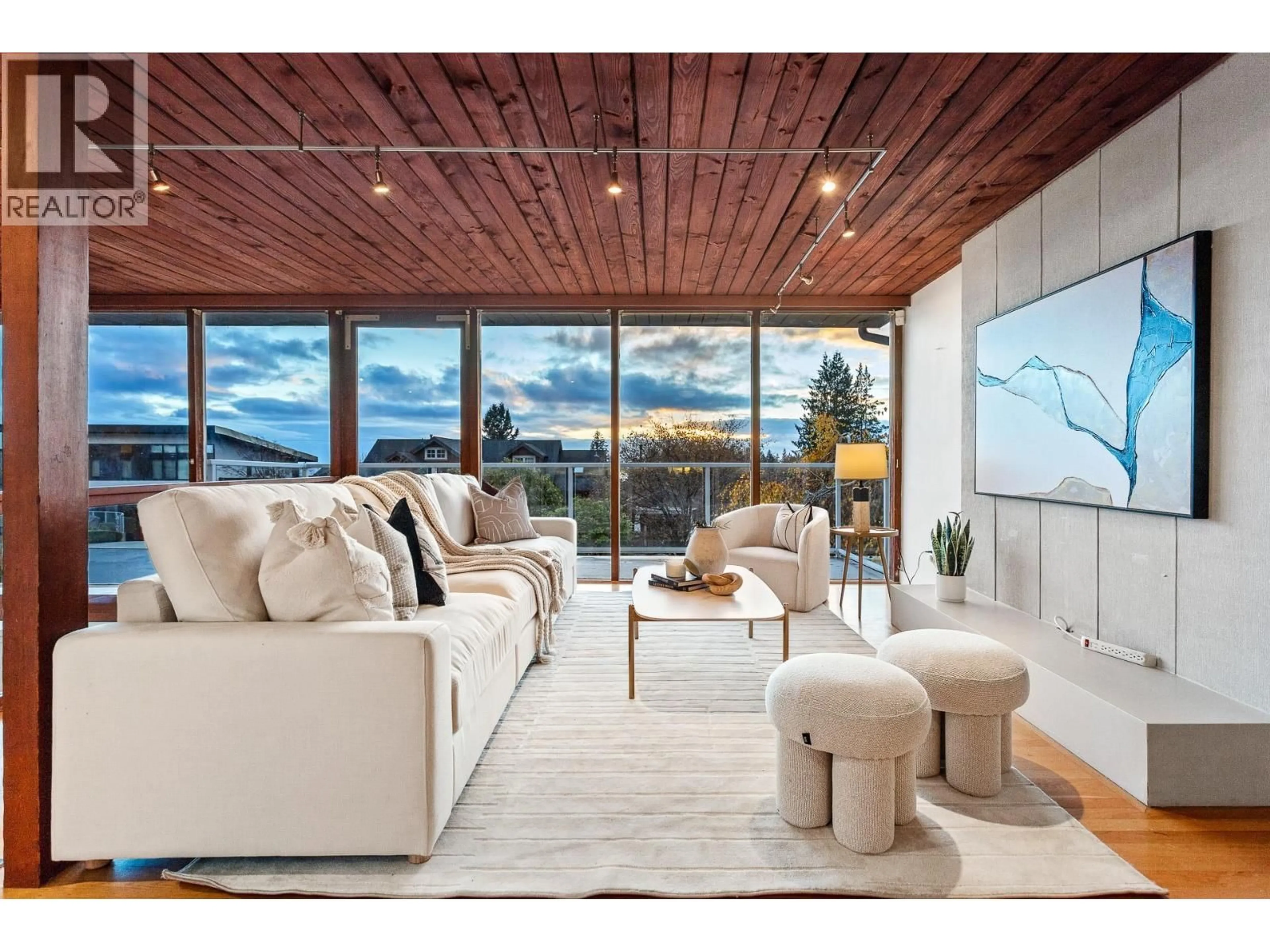 Living room with furniture, wood/laminate floor for 4150 CANTERBURY CRESCENT, North Vancouver British Columbia V7R3N5