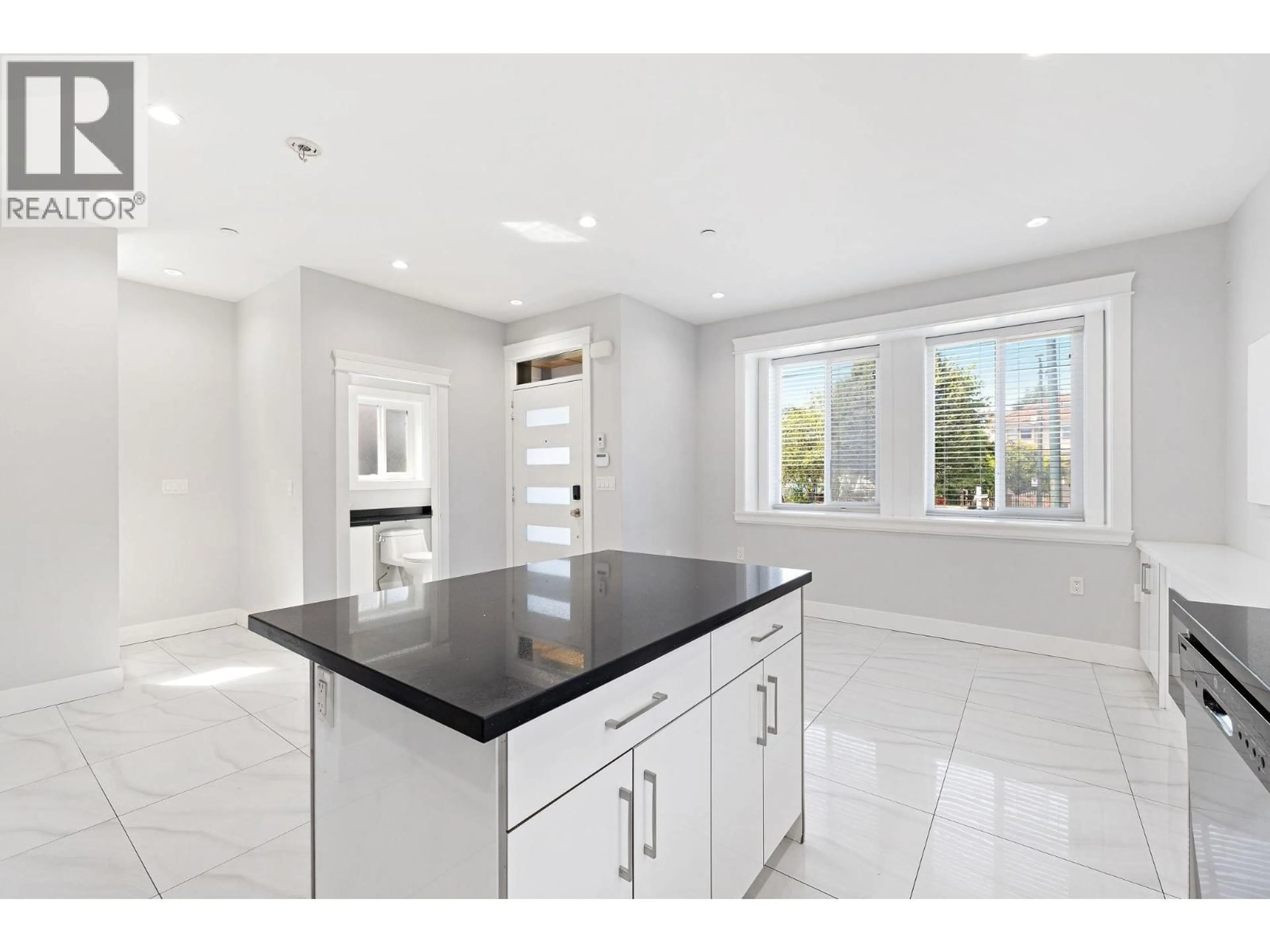 Open concept kitchen, ceramic/tile floor for 1 - 2430 41 AVENUE, Vancouver British Columbia V5R2W4