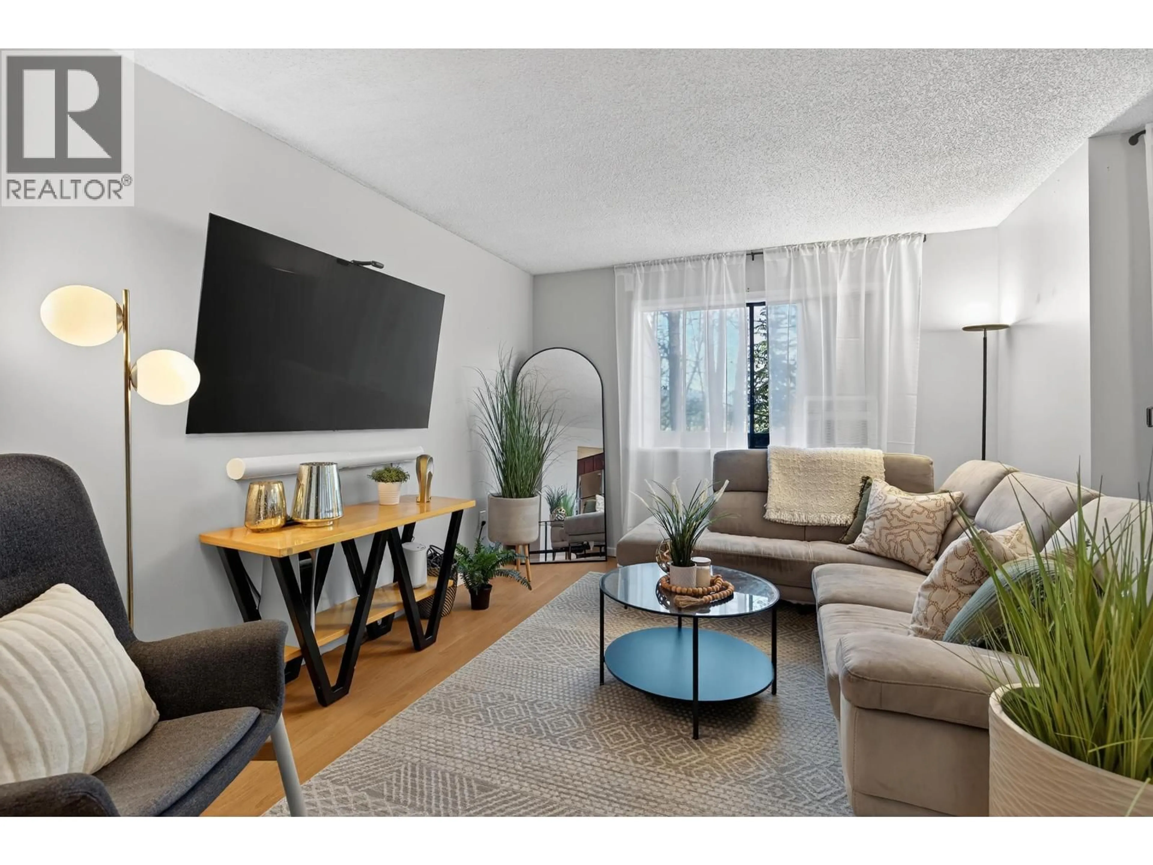 Living room with furniture, wood/laminate floor for 234 CORNELL WAY, Port Moody British Columbia V3H3W2