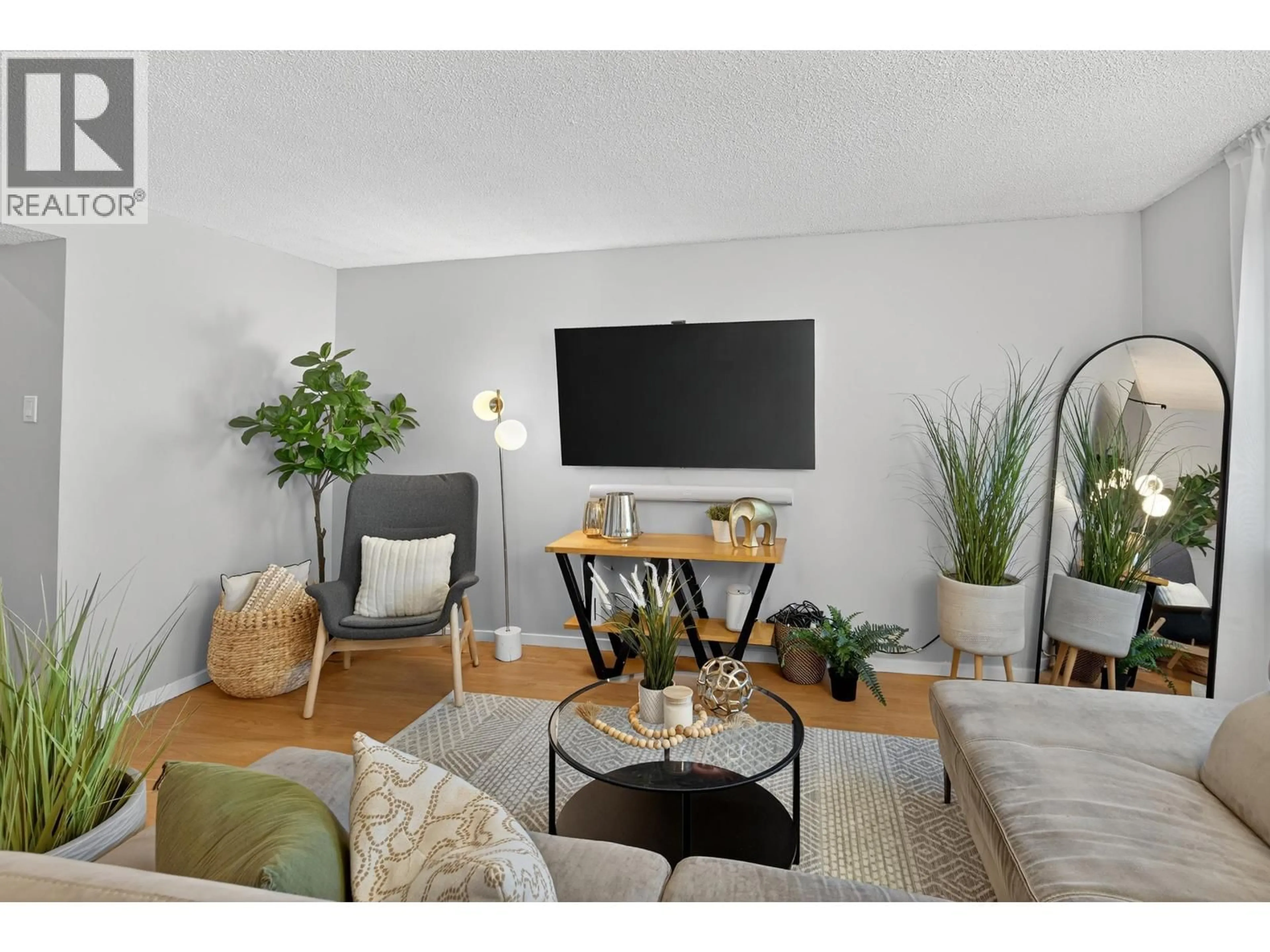 Living room with furniture, wood/laminate floor for 234 CORNELL WAY, Port Moody British Columbia V3H3W2