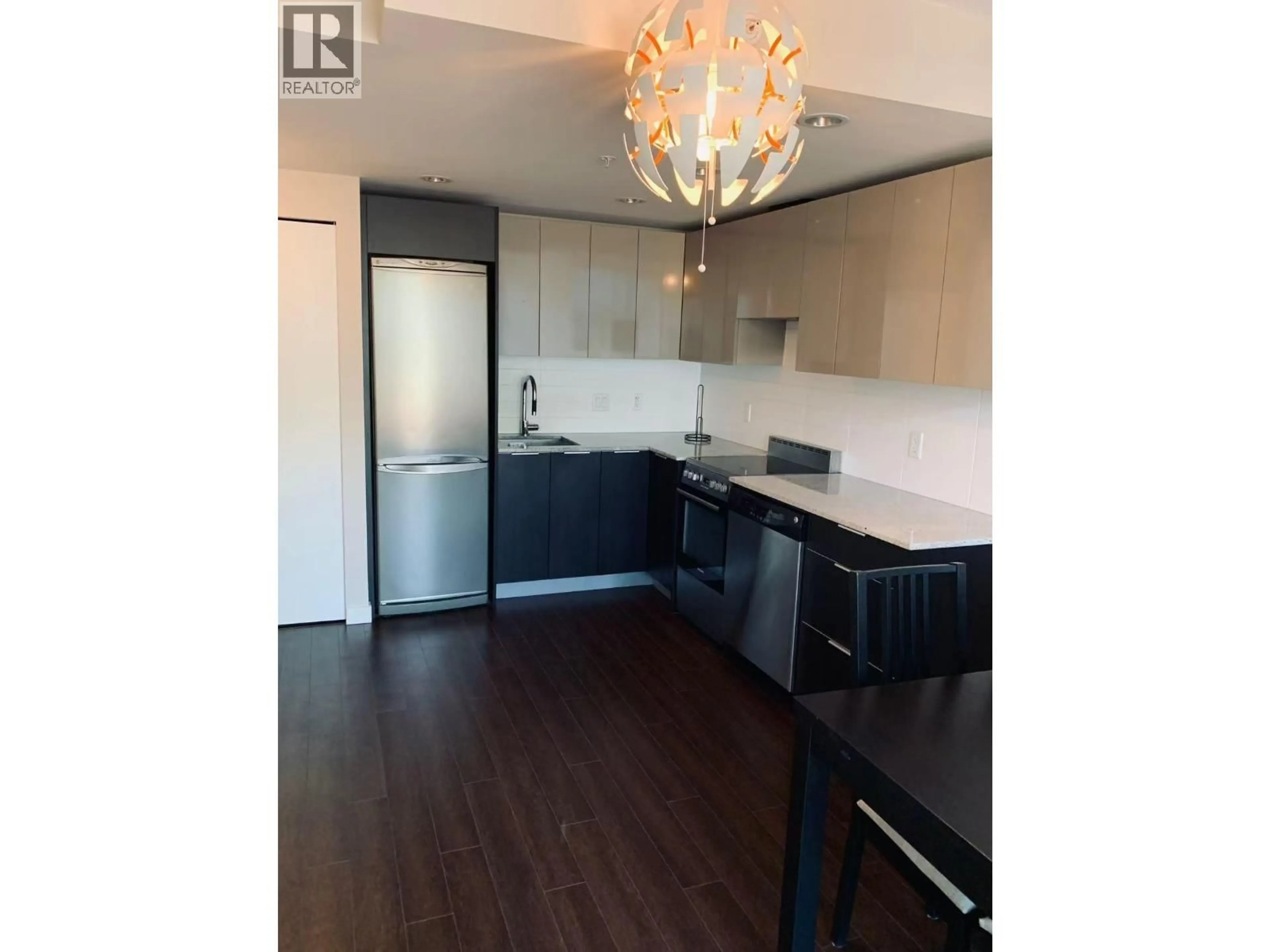 Open concept kitchen, wood/laminate floor for 501 - 1919 WYLIE STREET, Vancouver British Columbia V5Y0E7