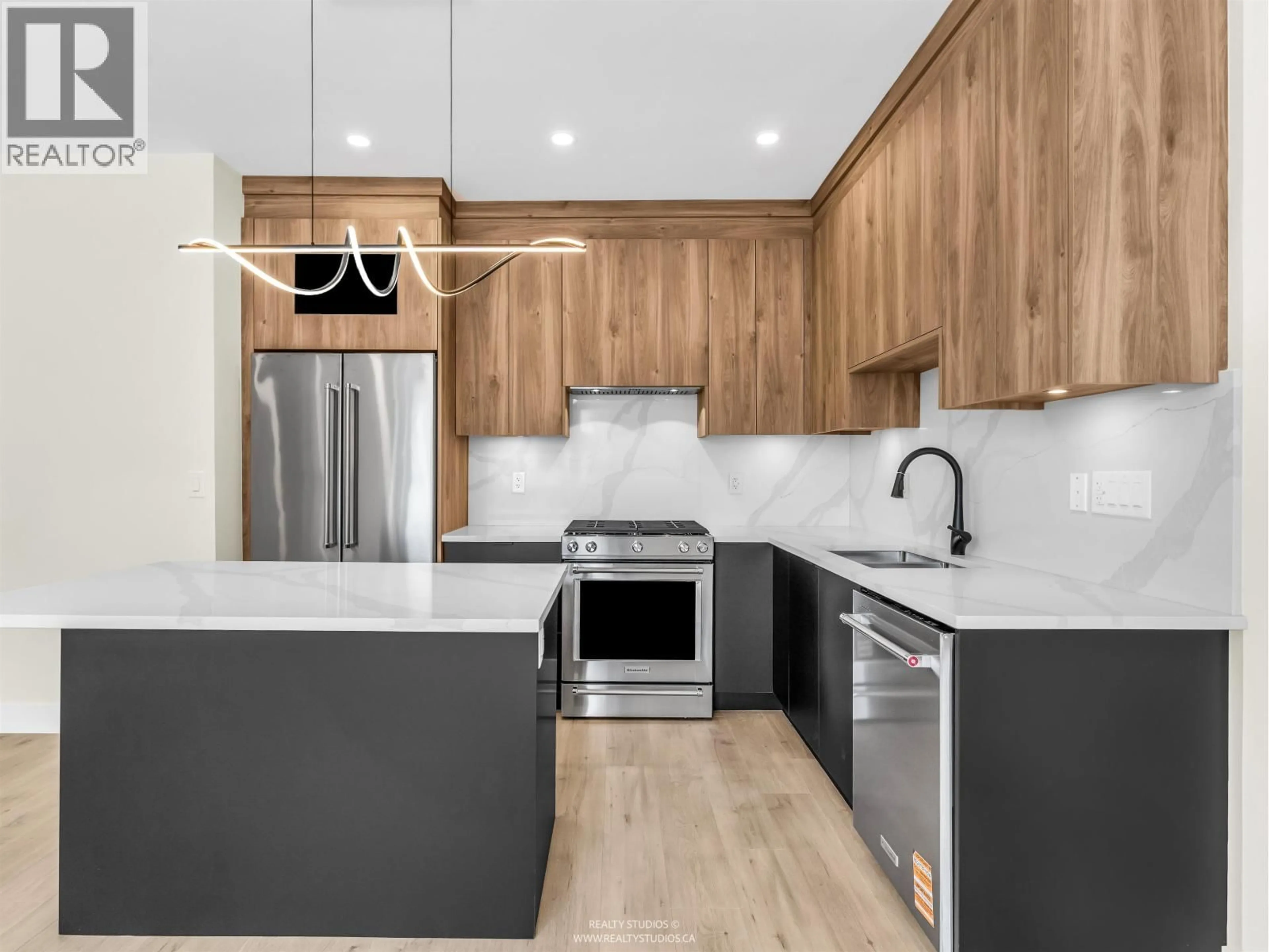 Open concept kitchen, unknown for 1 - 5221 CLARENDON STREET, Vancouver British Columbia V5R3J7