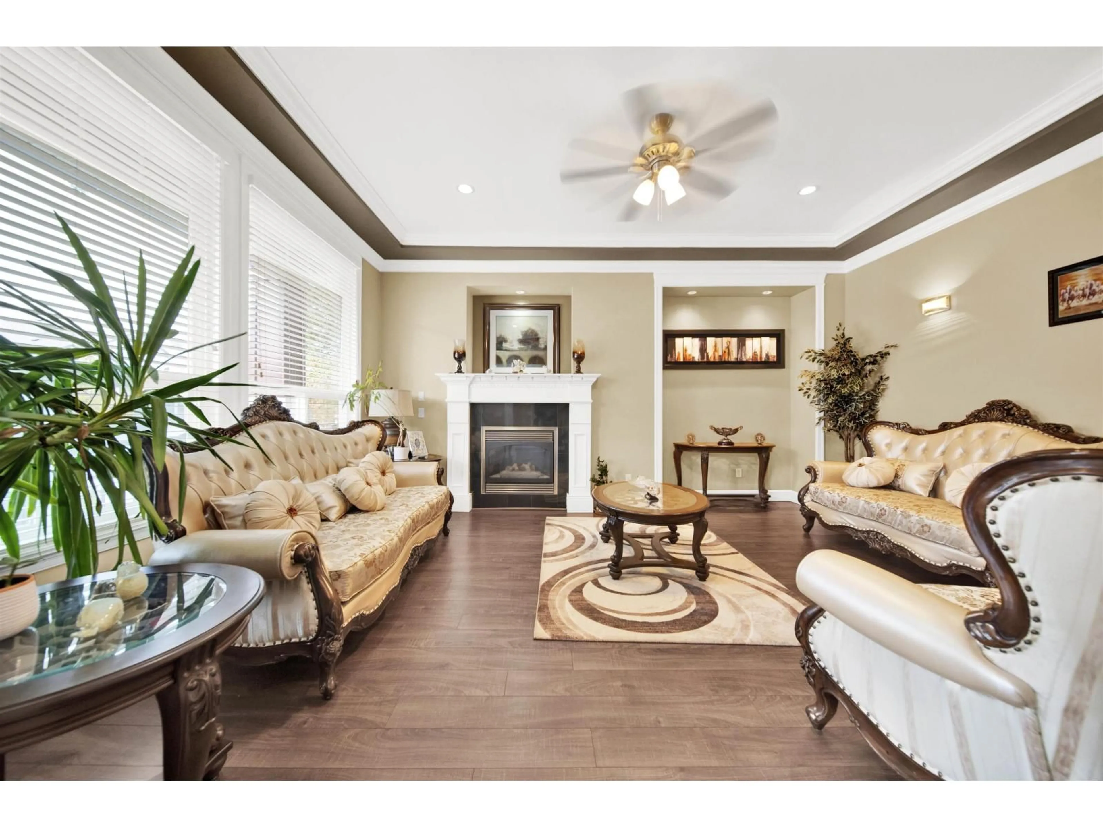 Living room with furniture, wood/laminate floor for 7120 148B, Surrey British Columbia V3S0X3