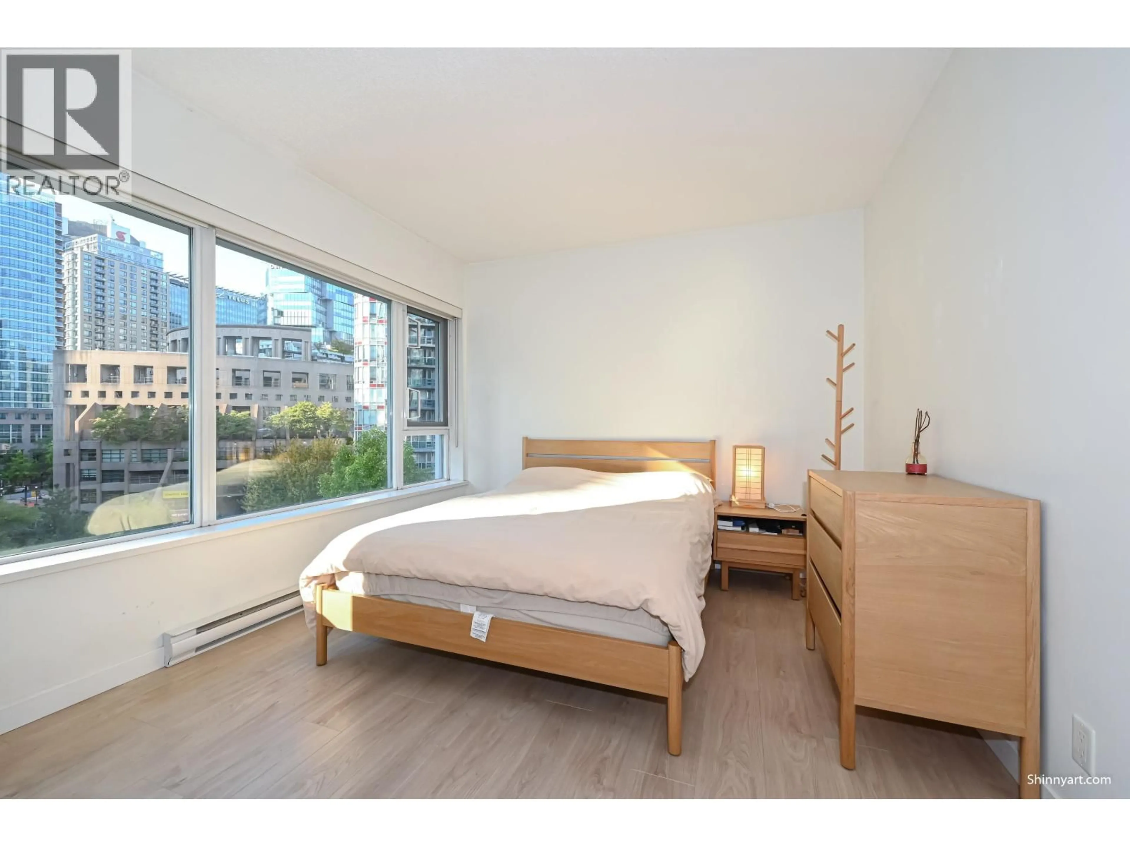 Bedroom with bed, wood/laminate floor for 802 - 821 CAMBIE STREET, Vancouver British Columbia V6B0E3