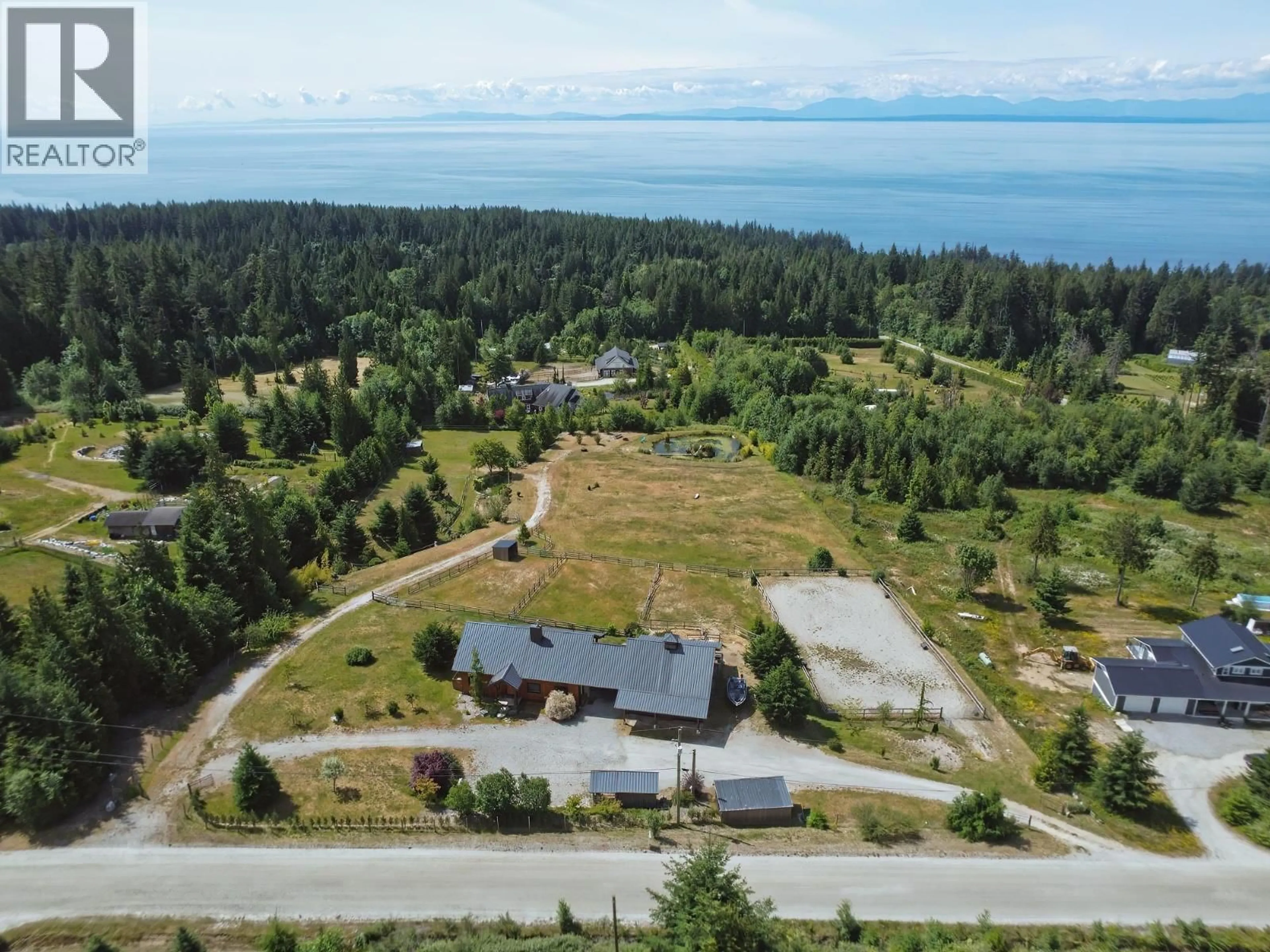 A pic from outside/outdoor area/front of a property/back of a property/a pic from drone, water/lake/river/ocean view for 2247 PIXTON ROAD, Roberts Creek British Columbia V0N2W5