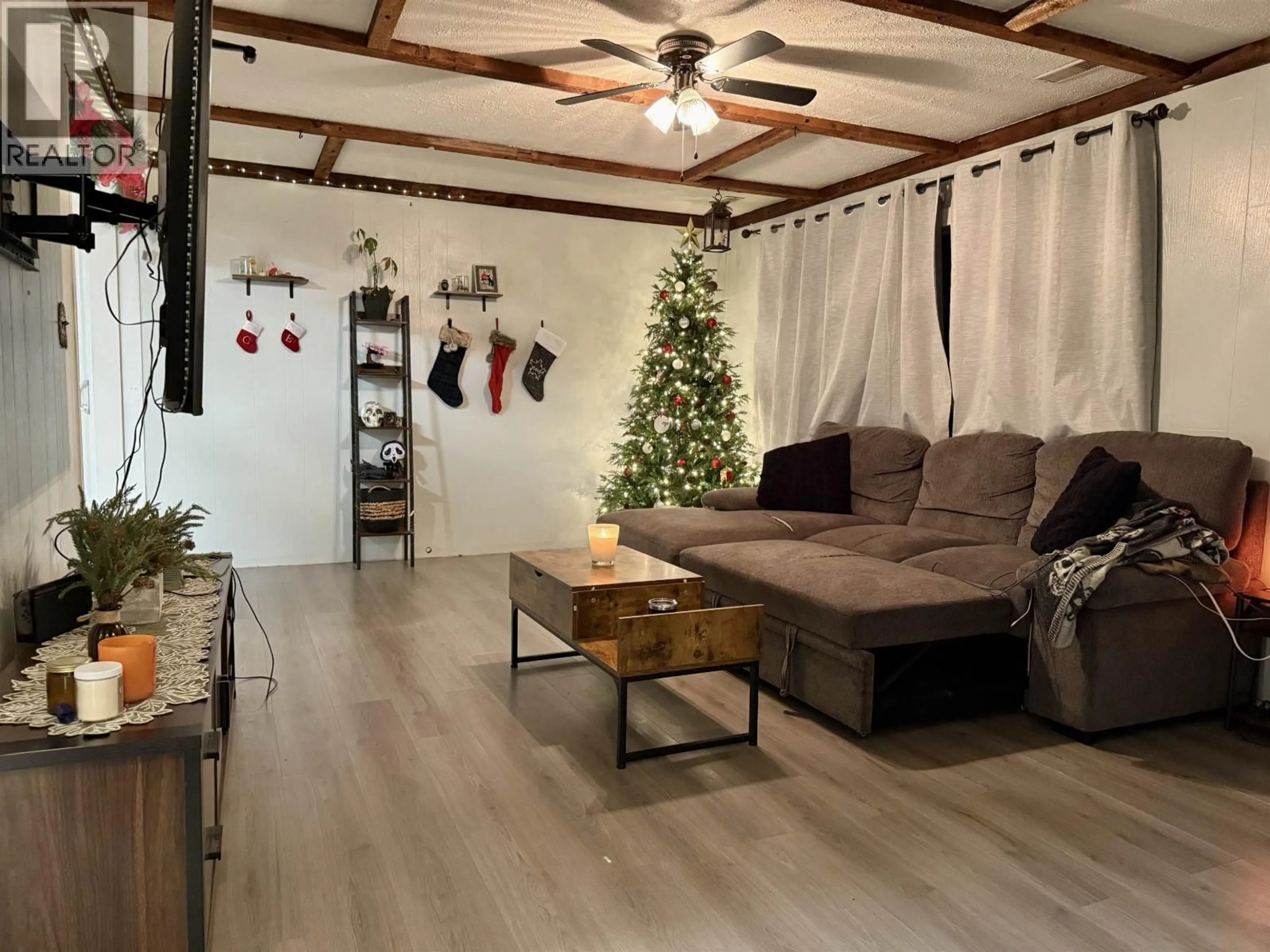 Living room with furniture, wood/laminate floor for 15 OMENICA STREET, Kitimat British Columbia V8C1Z5