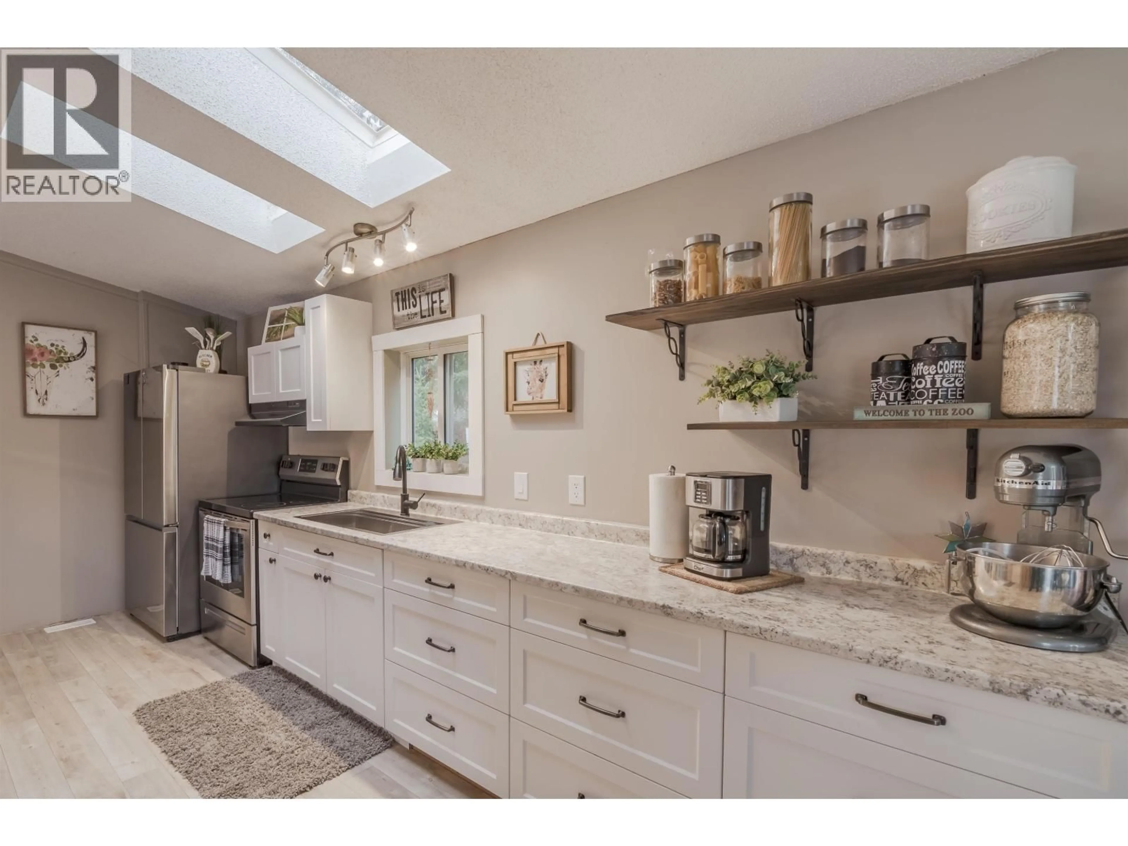 Open concept kitchen, ceramic/tile floor for 6324 WOLFE ROAD, 100 Mile House British Columbia V0K2E3