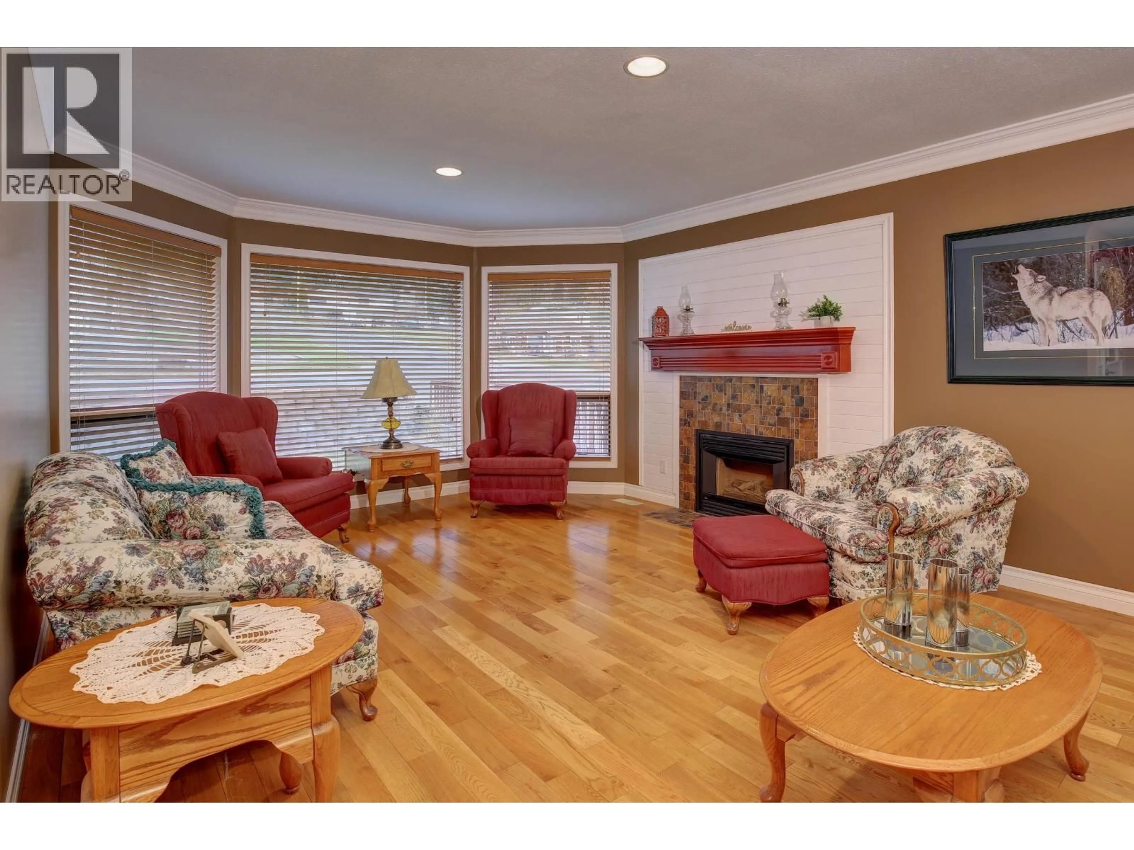 Living room with furniture, wood/laminate floor for 599 PEARKES DRIVE, Williams Lake British Columbia V2G4B1