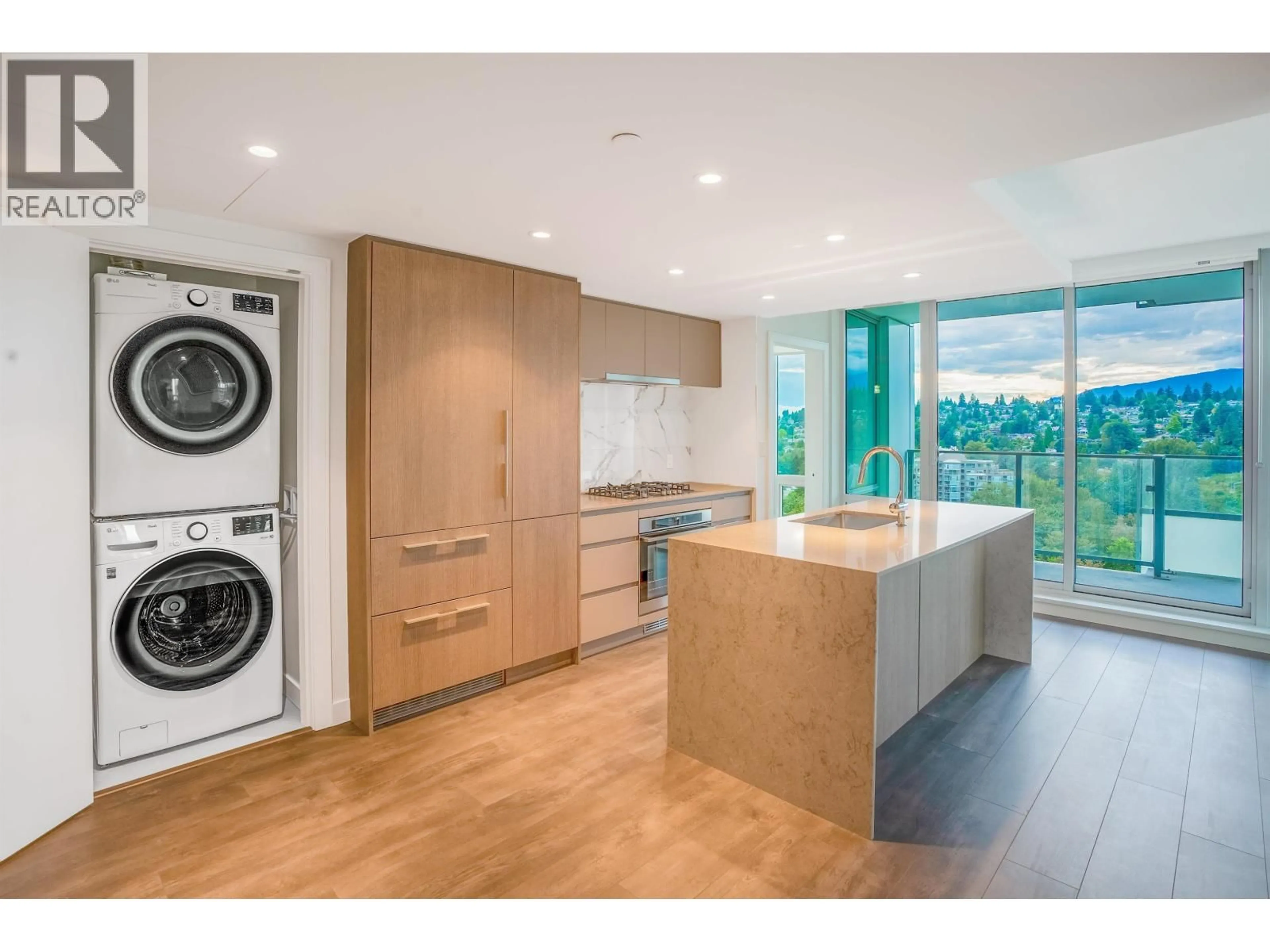 Kitchen with laundary machines, wood/laminate floor for 2201 - 1500 FERN STREET, North Vancouver British Columbia V7J0B6