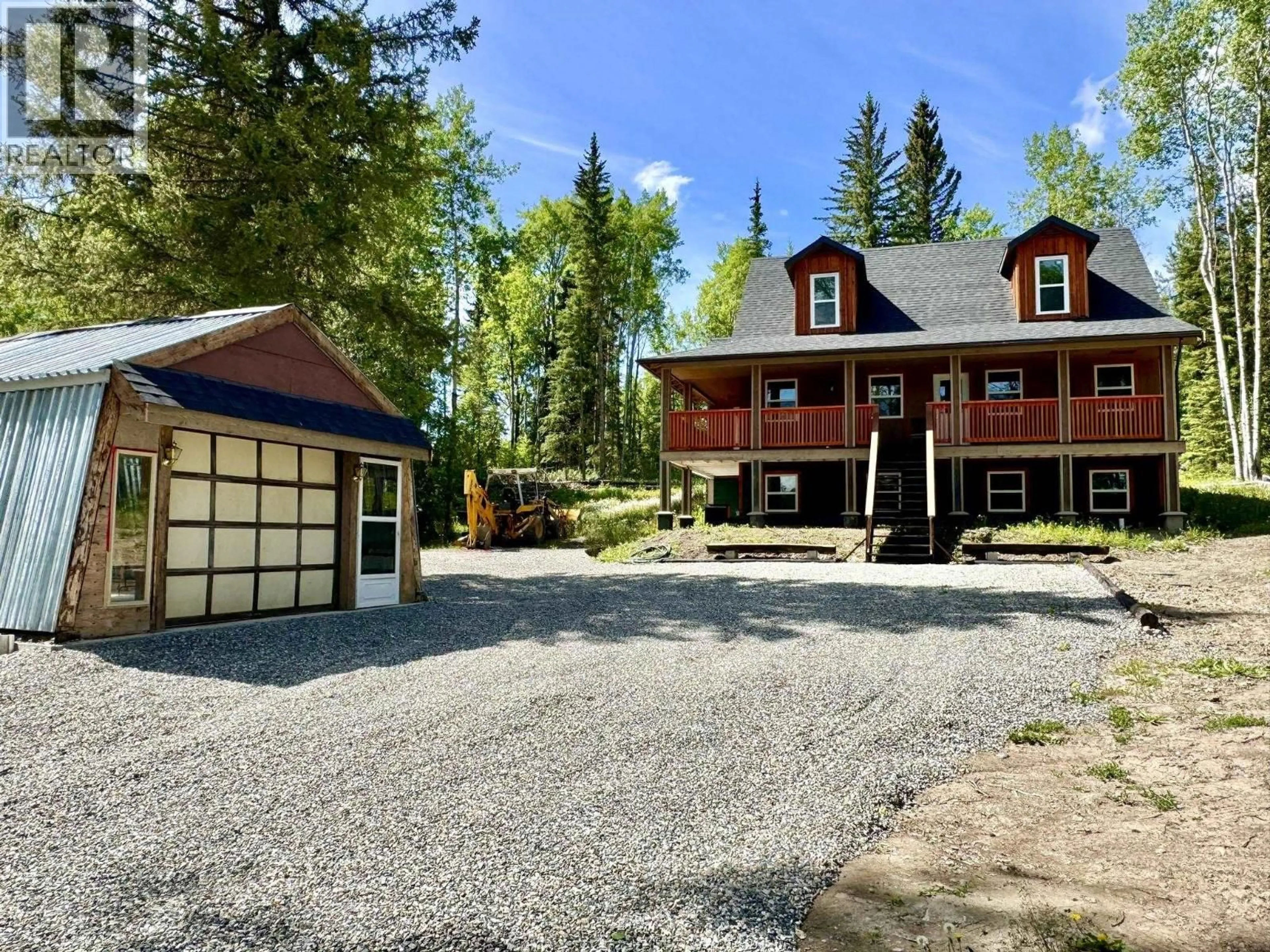 A pic from outside/outdoor area/front of a property/back of a property/a pic from drone, street for 6352 WOLFE ROAD, Horse Lake British Columbia V0K2E3