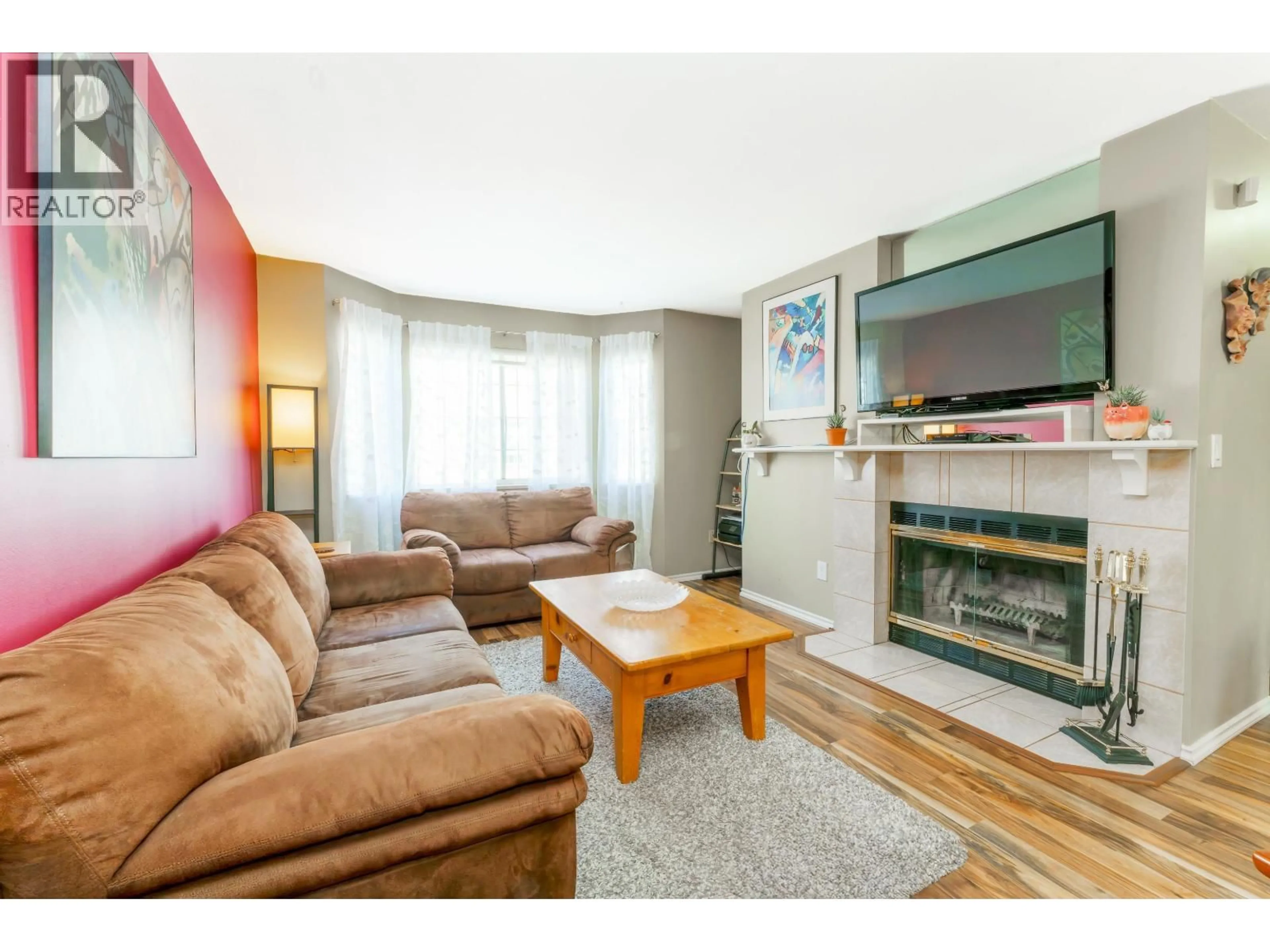 Living room with furniture, wood/laminate floor for 11 - 2352 PITT RIVER ROAD, Port Coquitlam British Columbia V3C5Y2