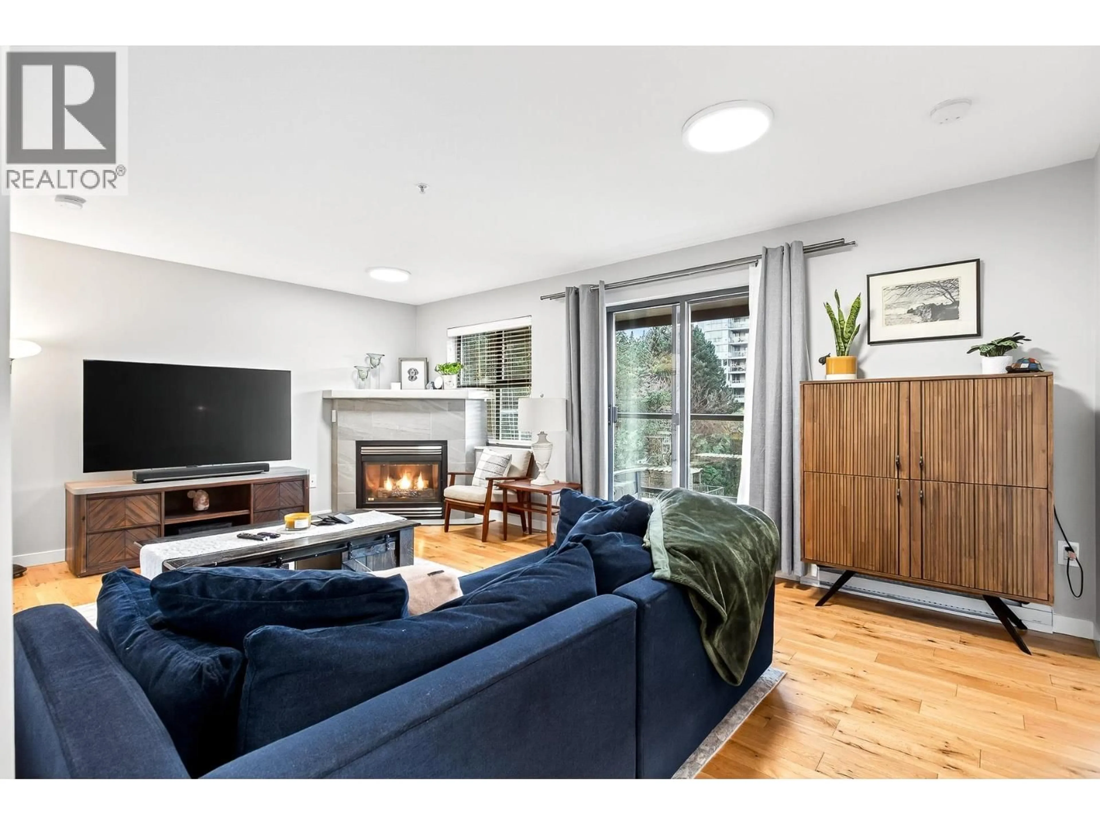 Living room with furniture, wood/laminate floor for 403 - 260 NEWPORT DRIVE, Port Moody British Columbia V3H5C6