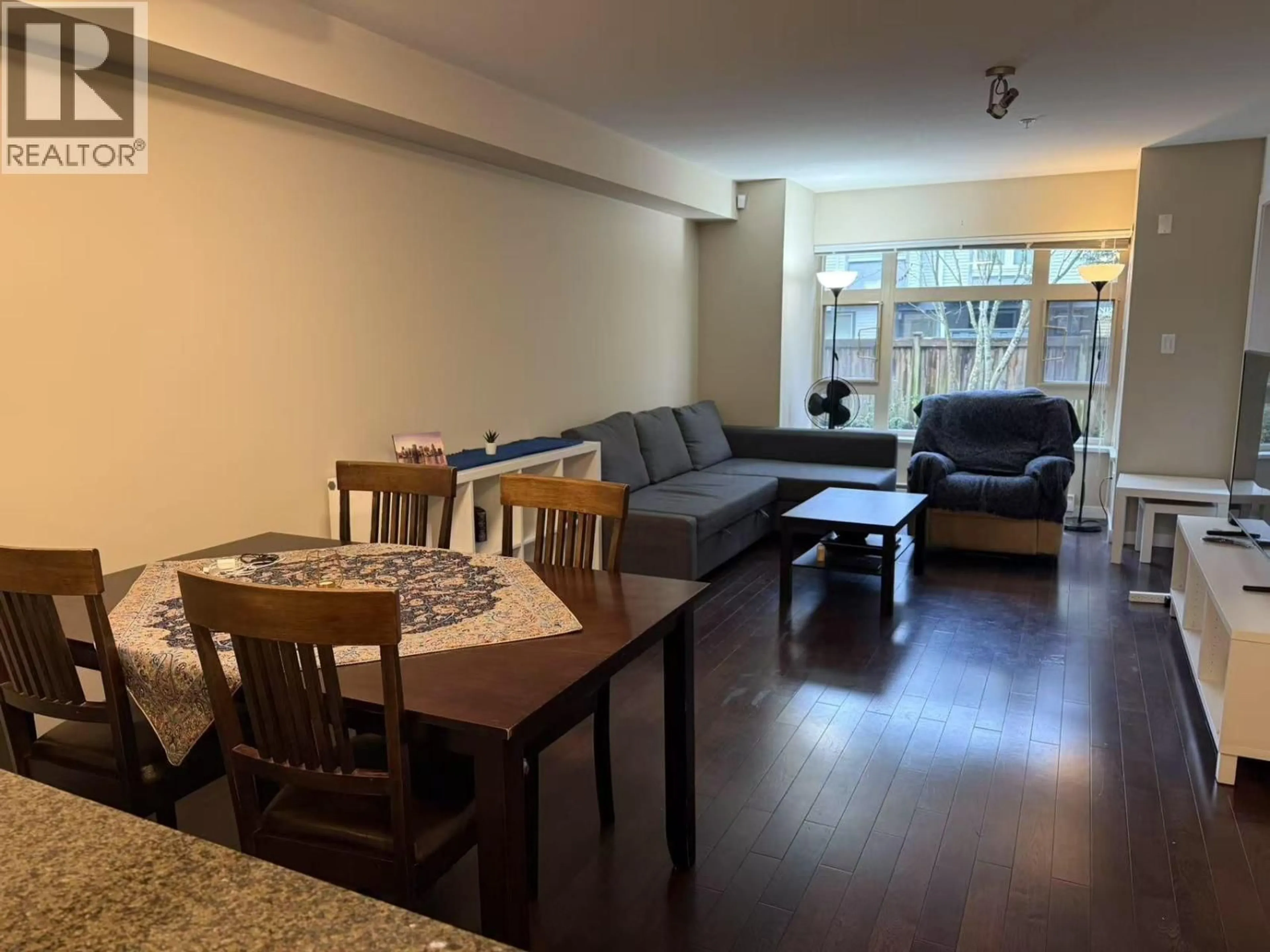 Living room with furniture, wood/laminate floor for 209 - 7337 MACPHERSON AVENUE, Burnaby British Columbia V5J0A9