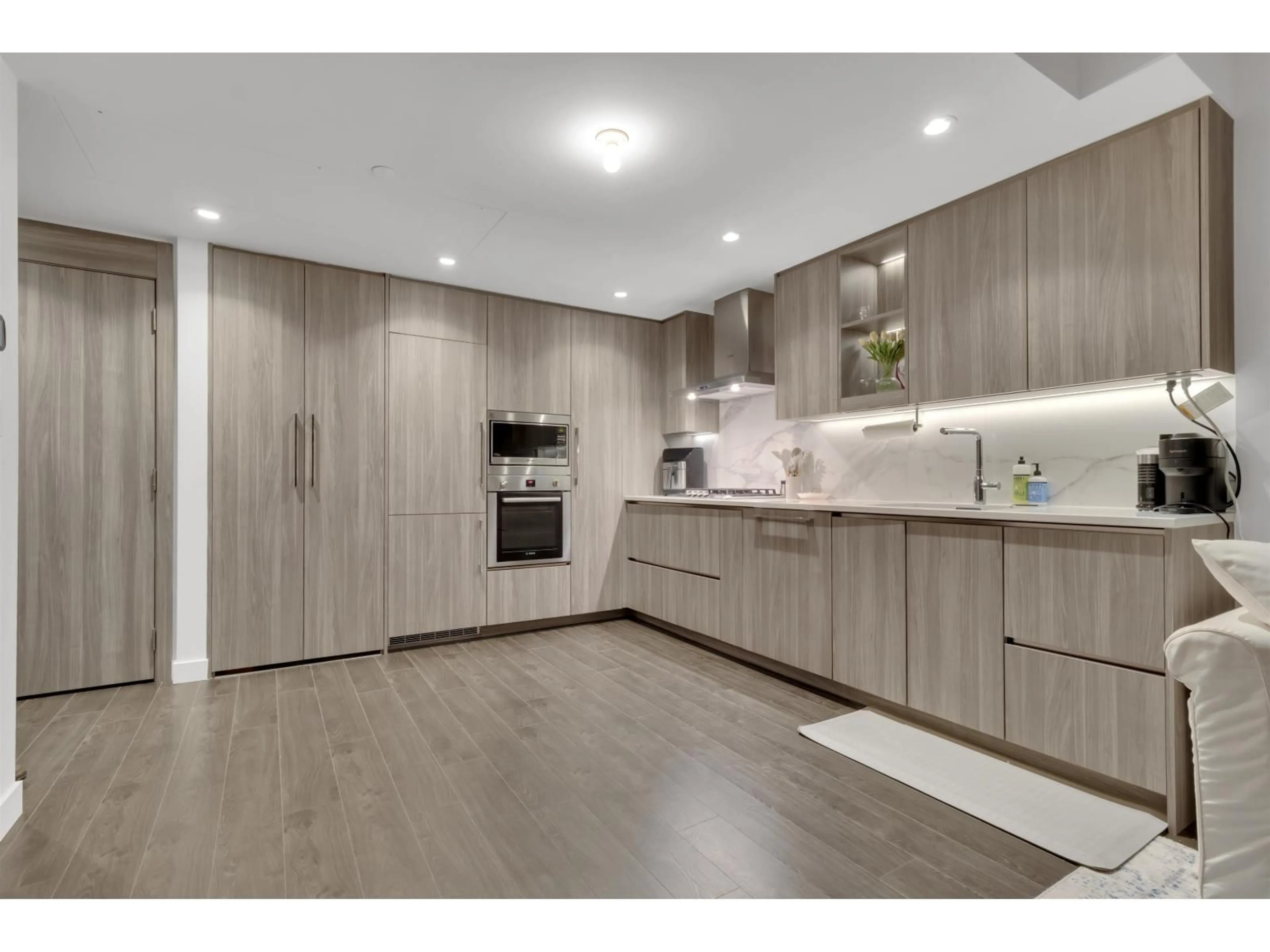 Open concept kitchen, wood/laminate floor for 3701 - 9887 WHALLEY BOULEVARD, Surrey British Columbia V3T0P4