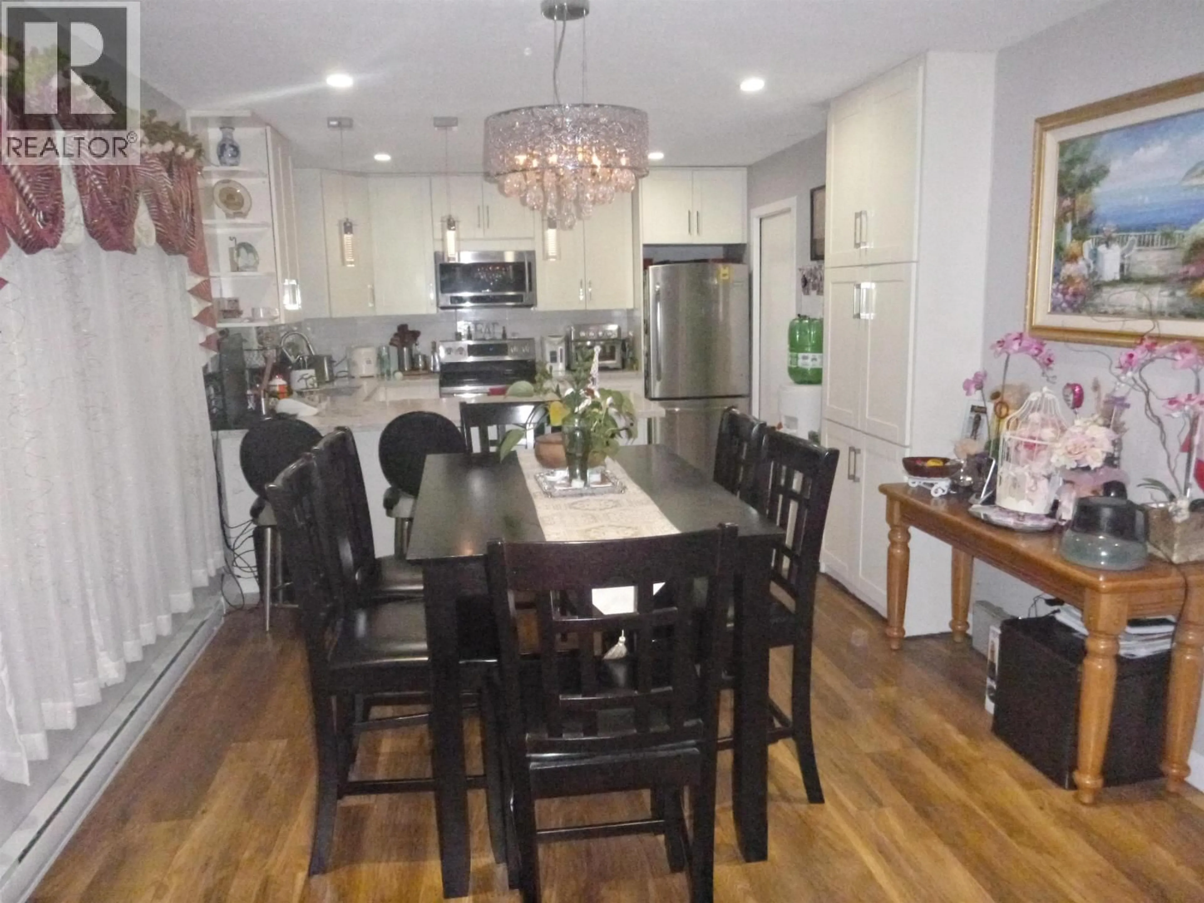 Open concept kitchen, wood/laminate floor for 11171 STEVESTON HIGHWAY, Richmond British Columbia V7A1N7