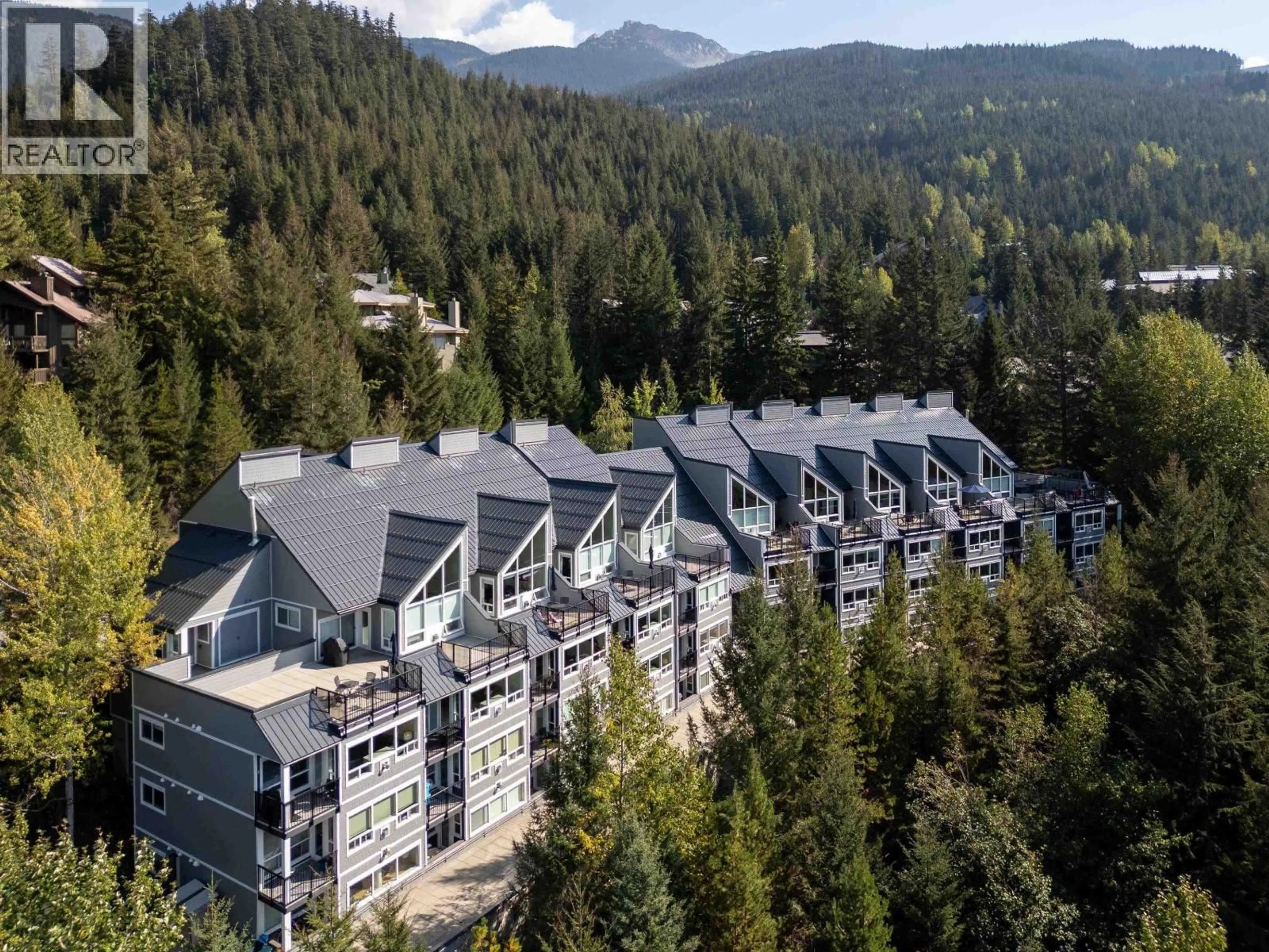 A pic from outside/outdoor area/front of a property/back of a property/a pic from drone, mountain view for 310 - 2221 GONDOLA WAY, Whistler British Columbia V8E0M8