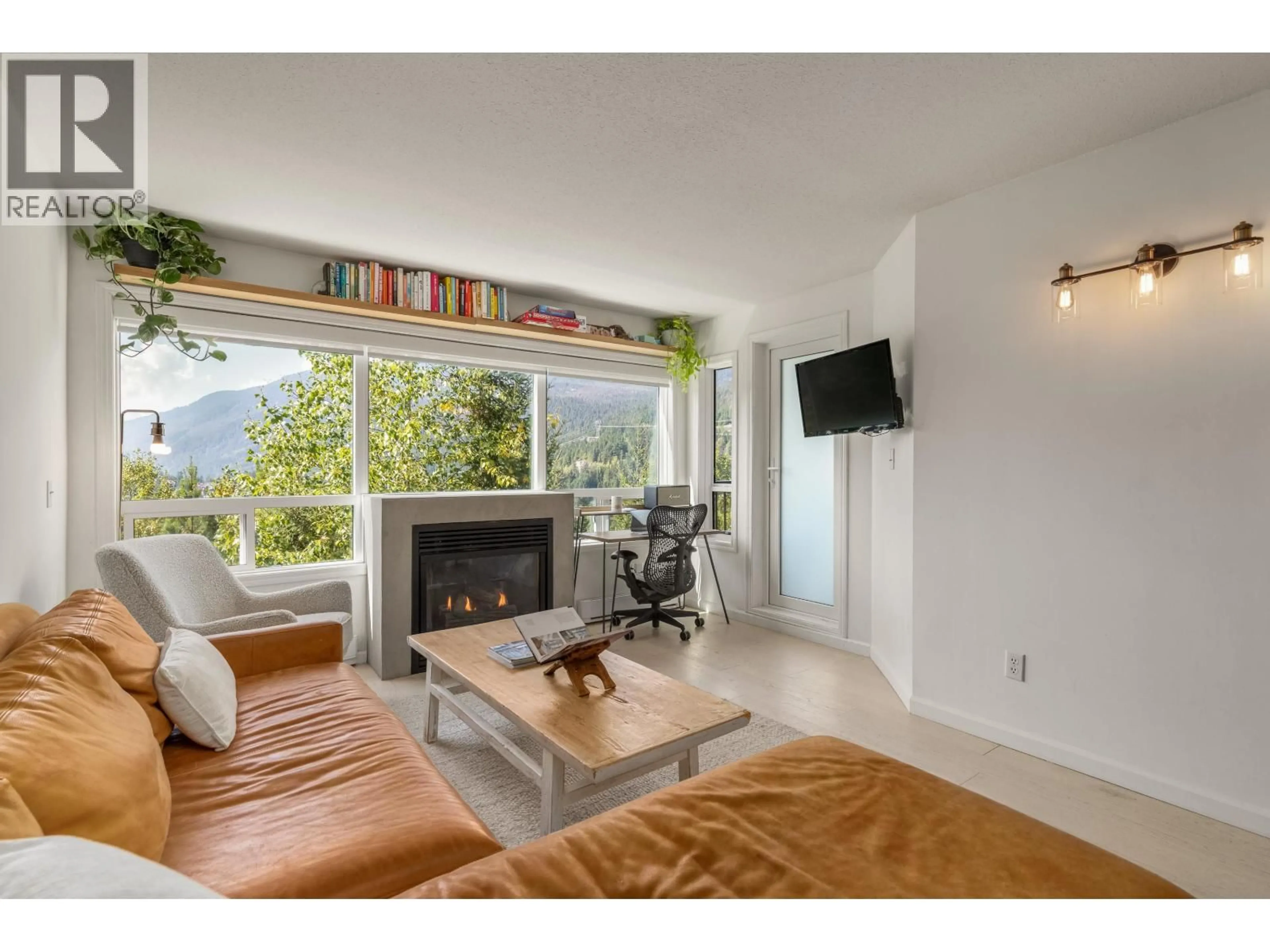 Living room with furniture, unknown for 310 - 2221 GONDOLA WAY, Whistler British Columbia V8E0M8