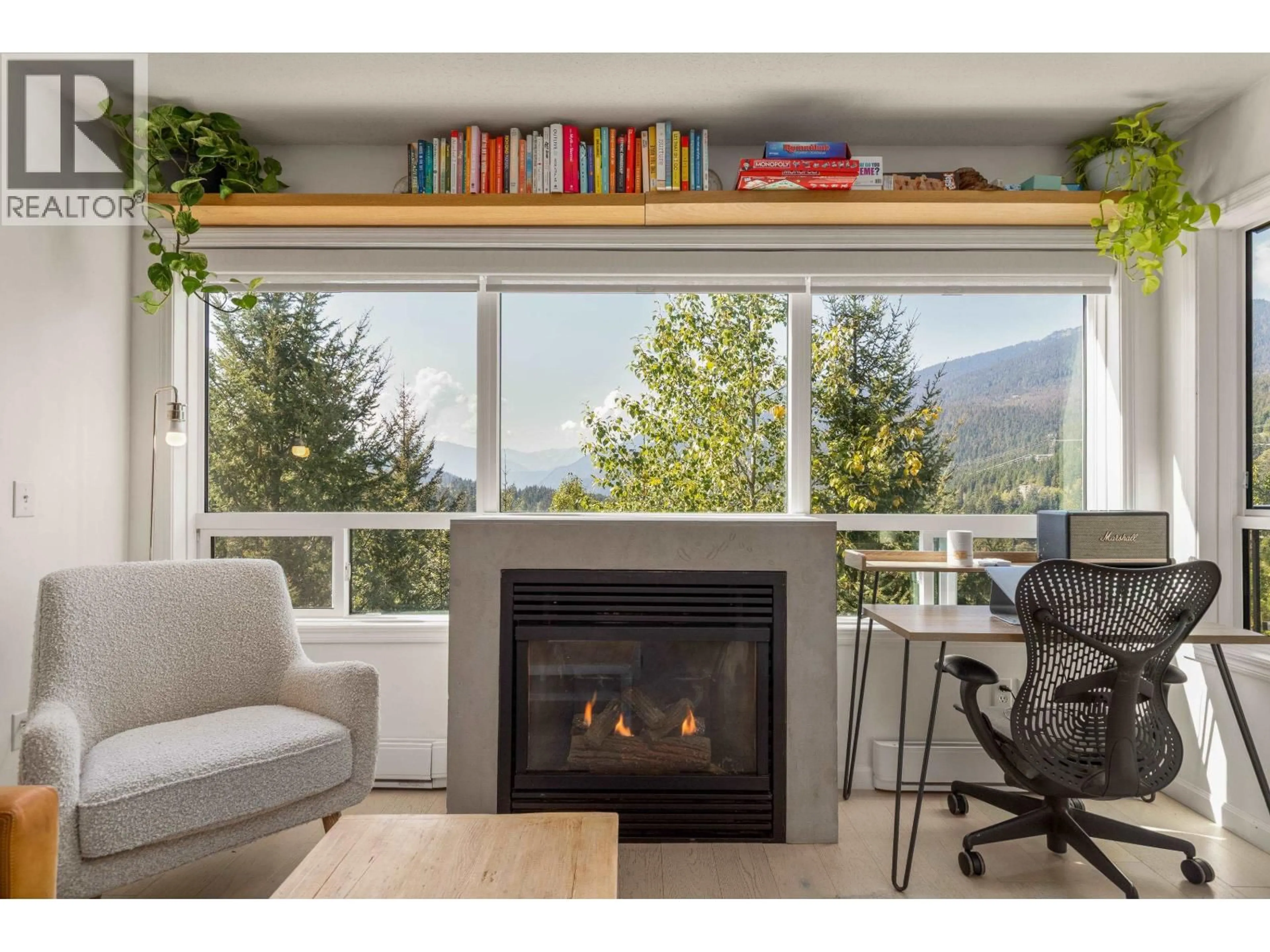 Living room with furniture, wood/laminate floor for 310 - 2221 GONDOLA WAY, Whistler British Columbia V8E0M8