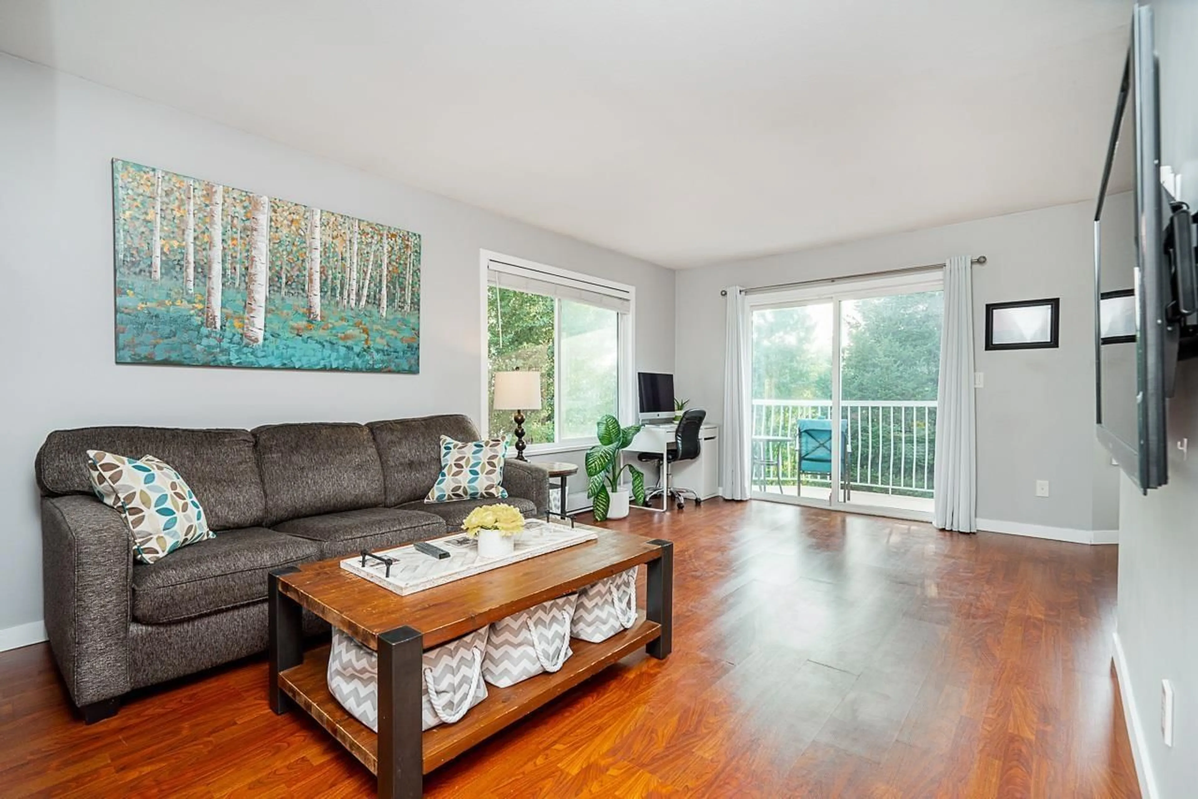 Living room with furniture, wood/laminate floor for 309 - 45222 WATSON ROAD, Chilliwack British Columbia V2R3J4