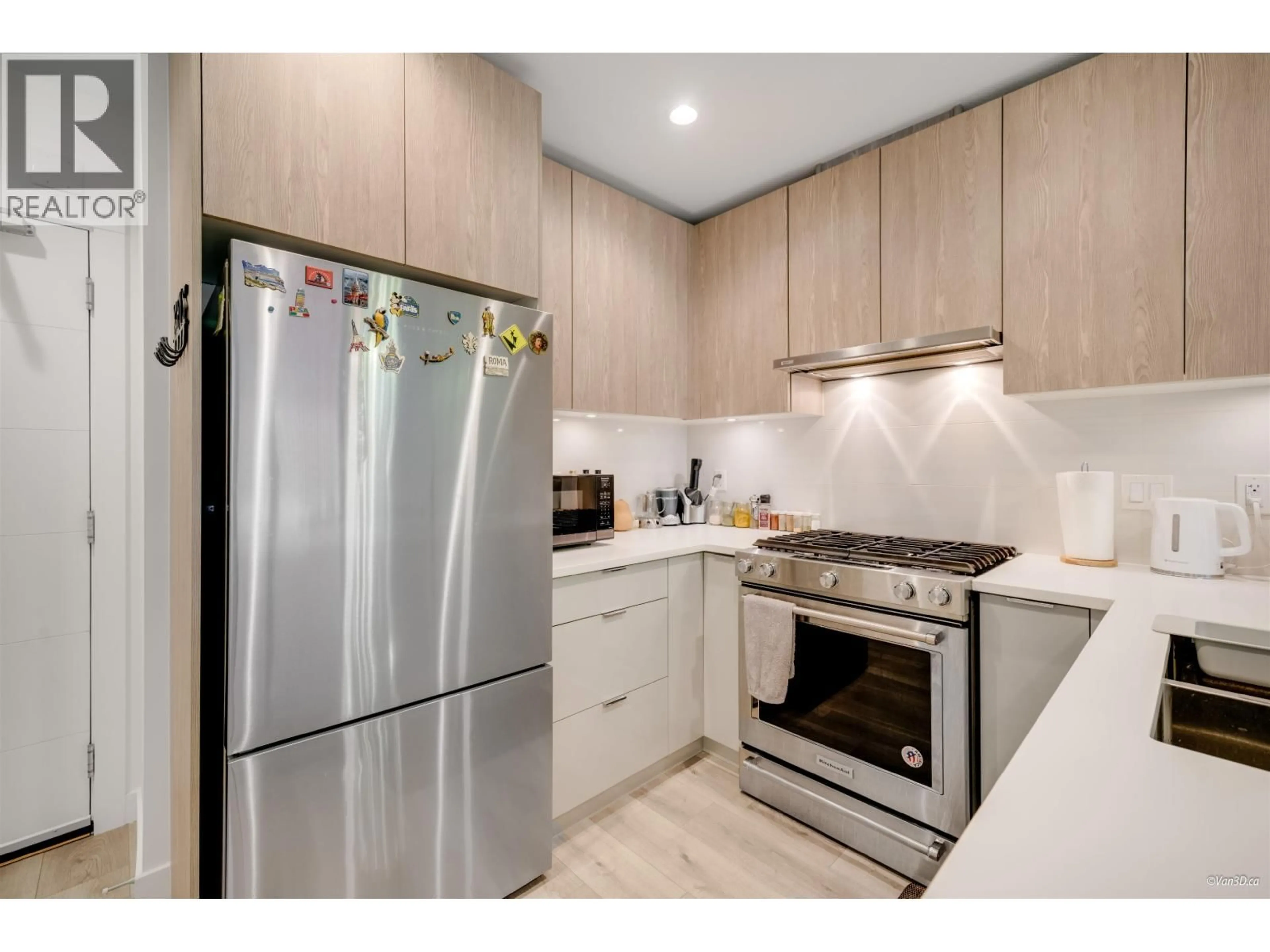 Standard kitchen, wood/laminate floor for 207 - 128 8TH STREET, North Vancouver British Columbia V7L0H2