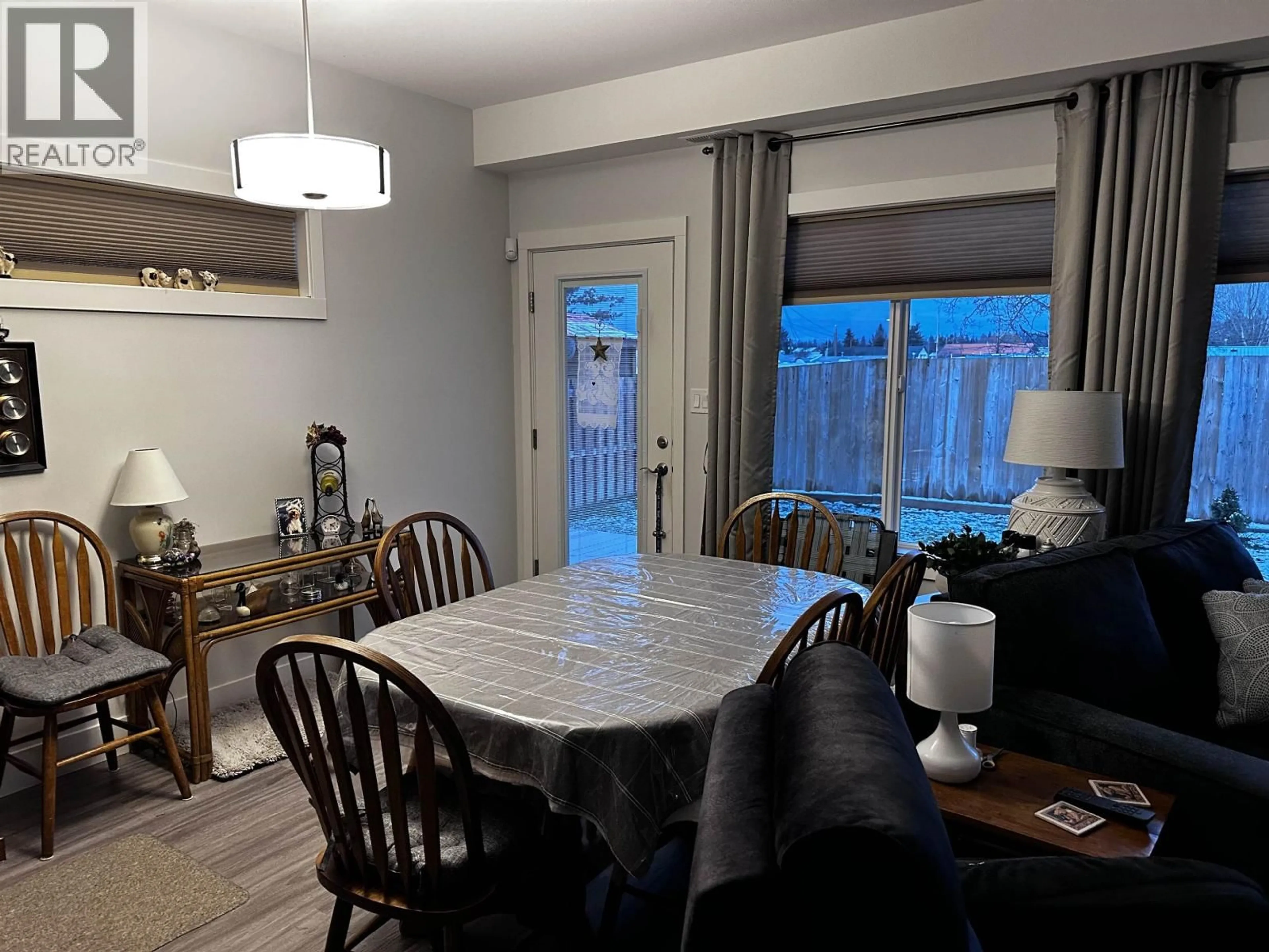 Dining room, wood/laminate floor for 382 SANDHILL CRESCENT, 100 Mile House British Columbia V0K2E0