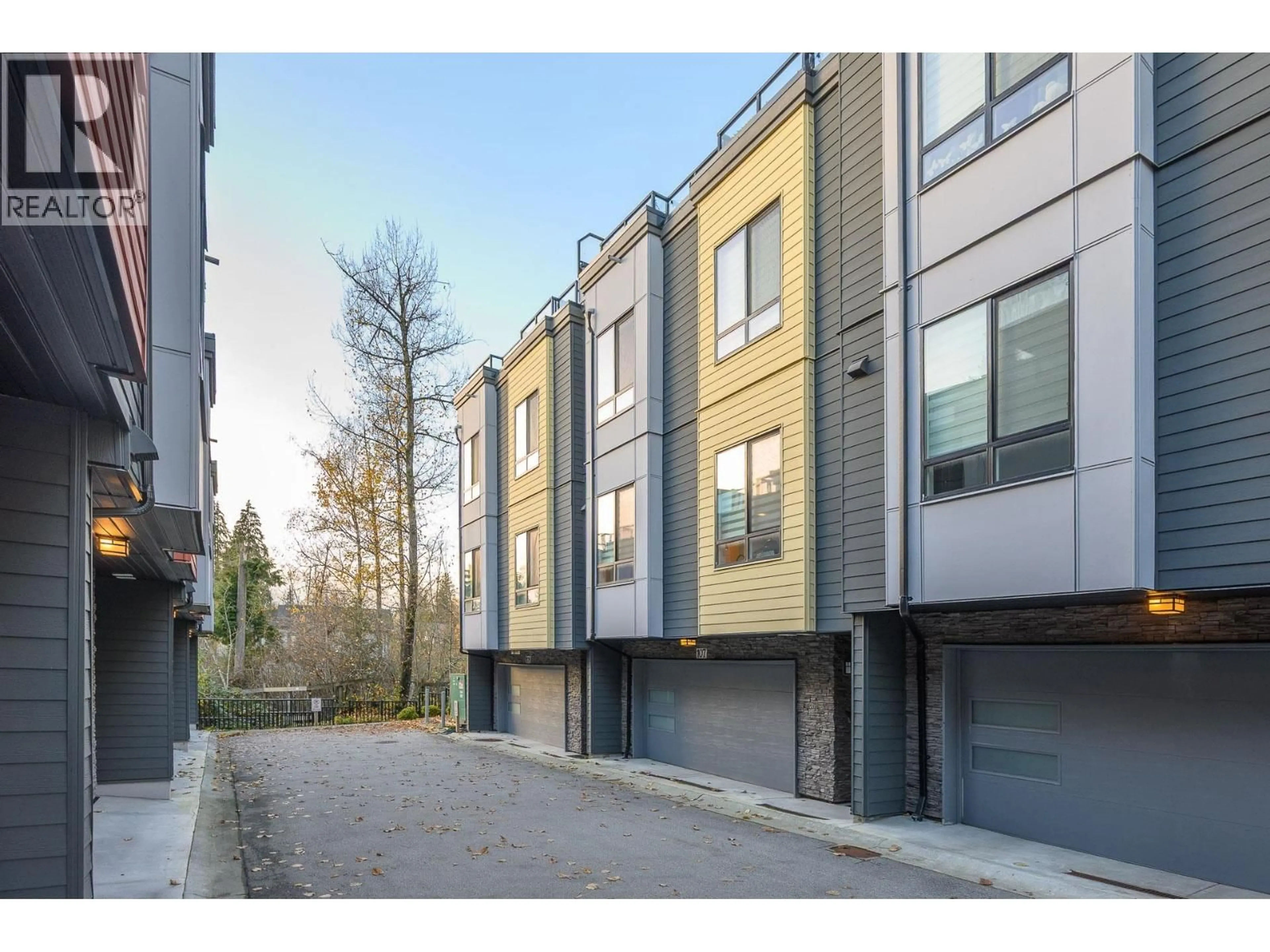 A pic from outside/outdoor area/front of a property/back of a property/a pic from drone, street for 107 - 3503 GISLASON AVENUE, Coquitlam British Columbia V3E0T1