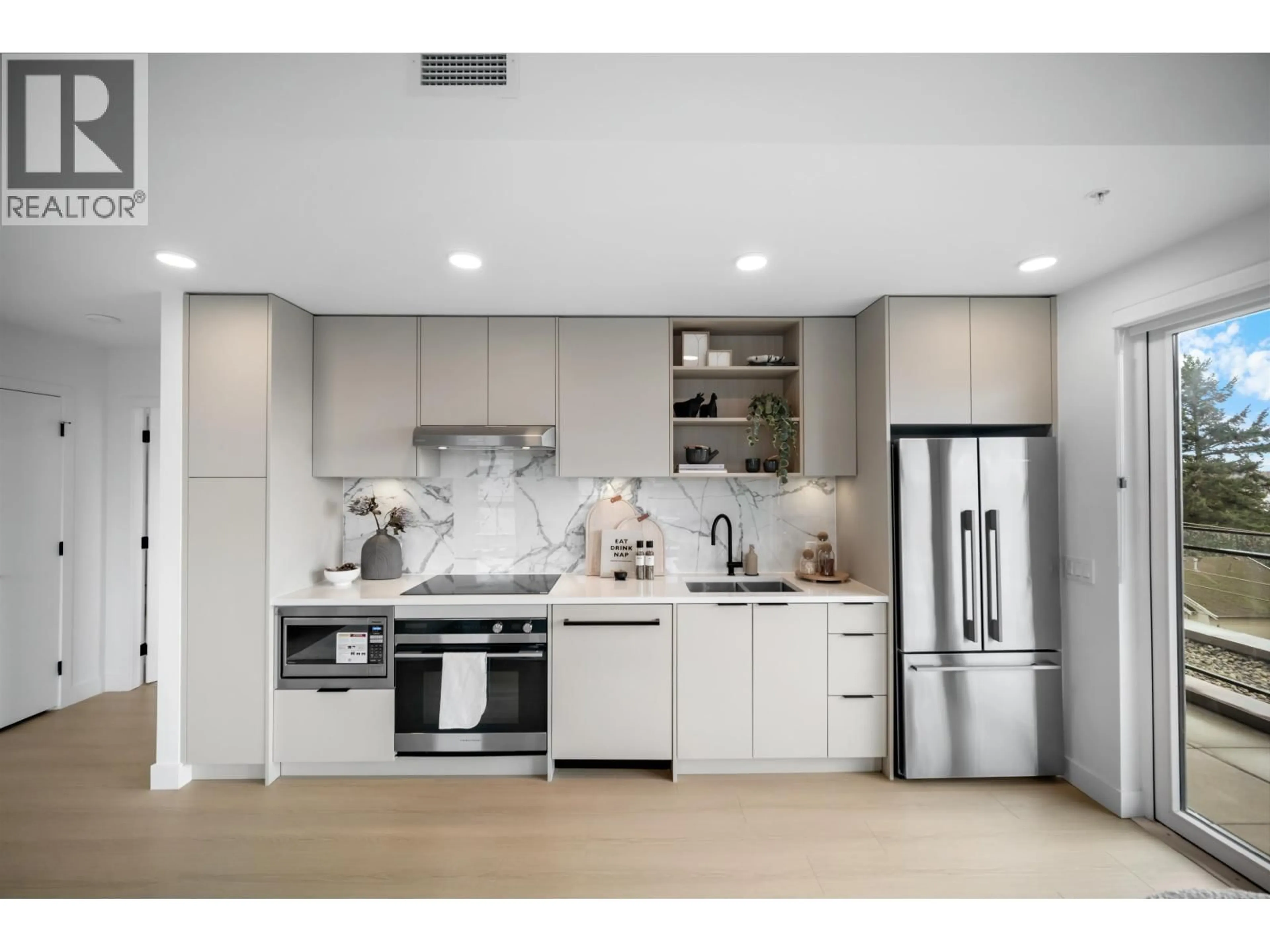 Open concept kitchen, ceramic/tile floor for 501 - 422 3RD STREET, North Vancouver British Columbia V7L0K1