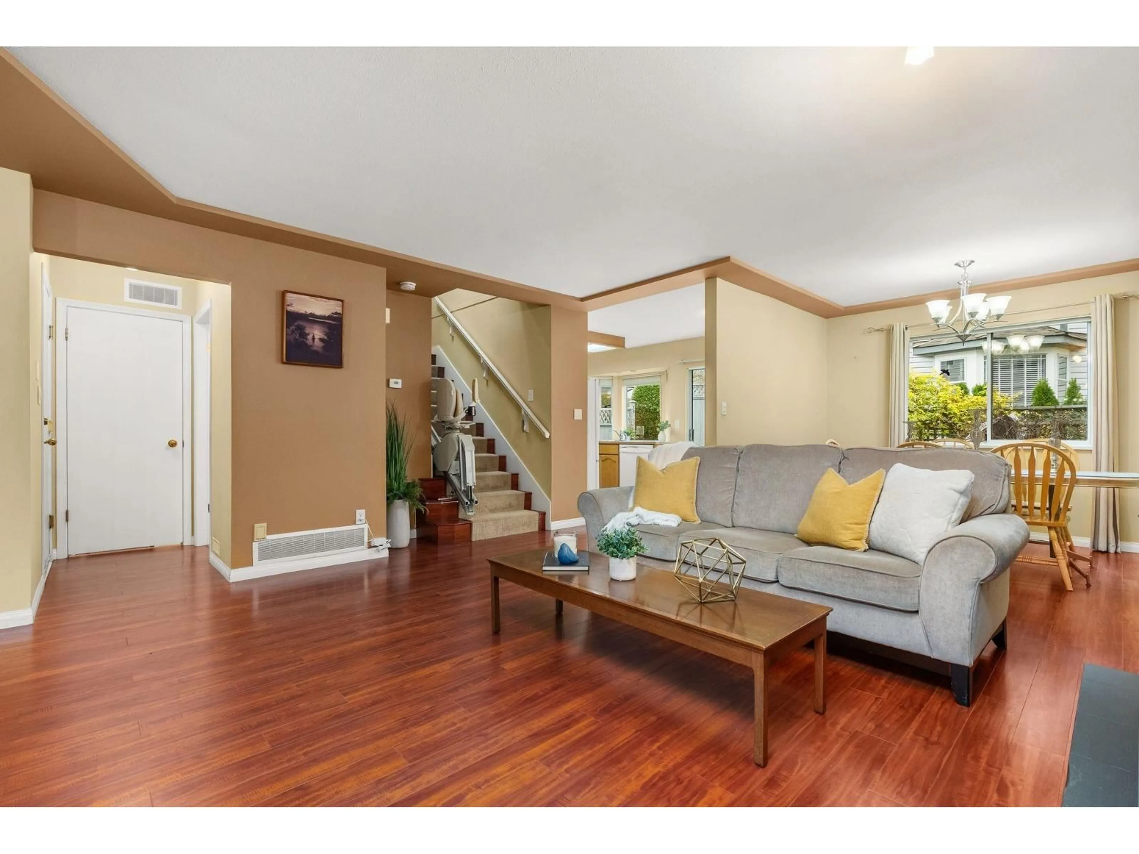 Living room with furniture, wood/laminate floor for 121 - 12044 BOUNDARY DRIVE, Surrey British Columbia V3X2B4