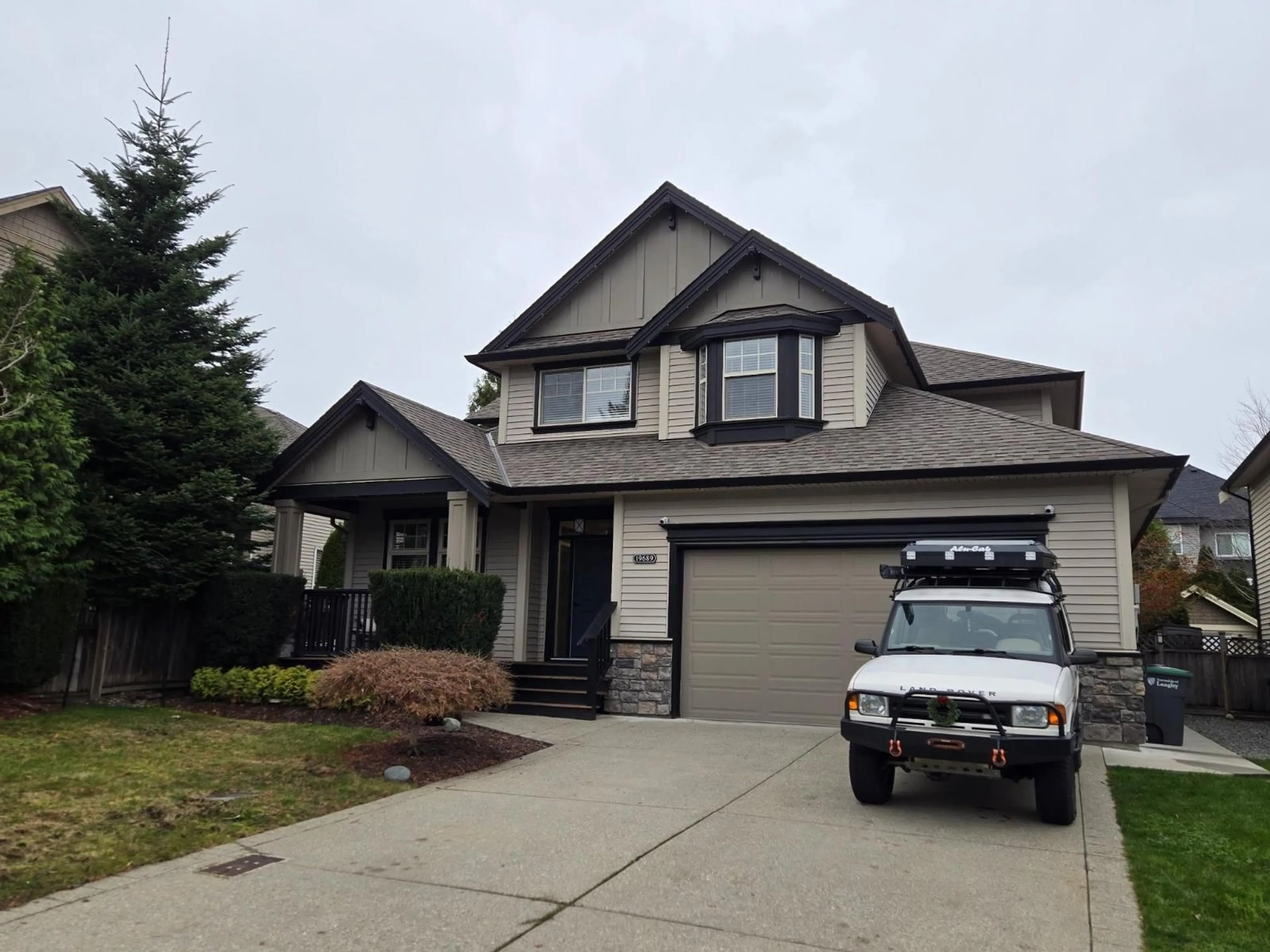 Home with vinyl exterior material, street for 19689 70 AVENUE, Langley British Columbia V2Y3E8