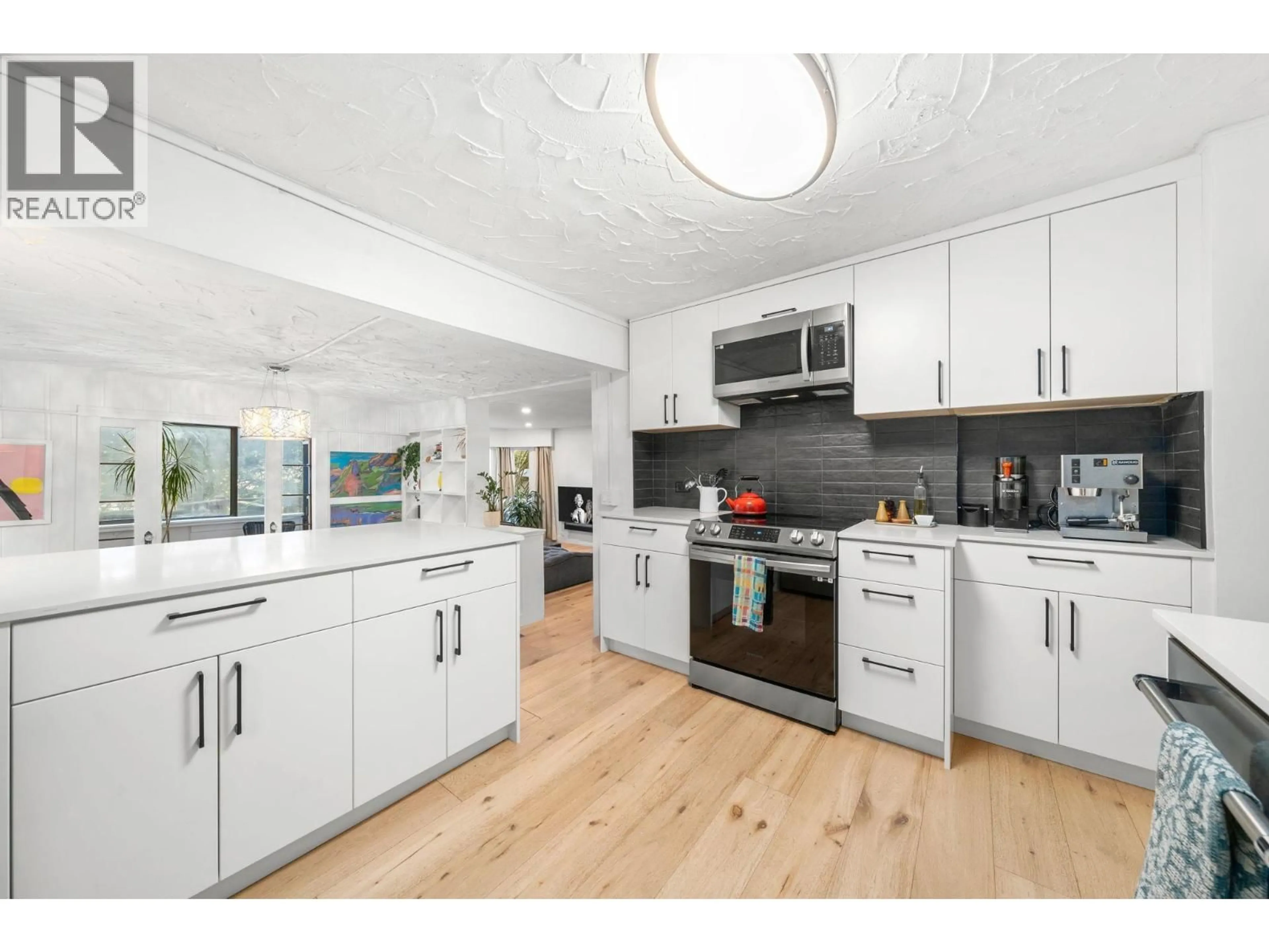 Open concept kitchen, wood/laminate floor for 2052 CAPILANO ROAD, North Vancouver British Columbia V7P3B8