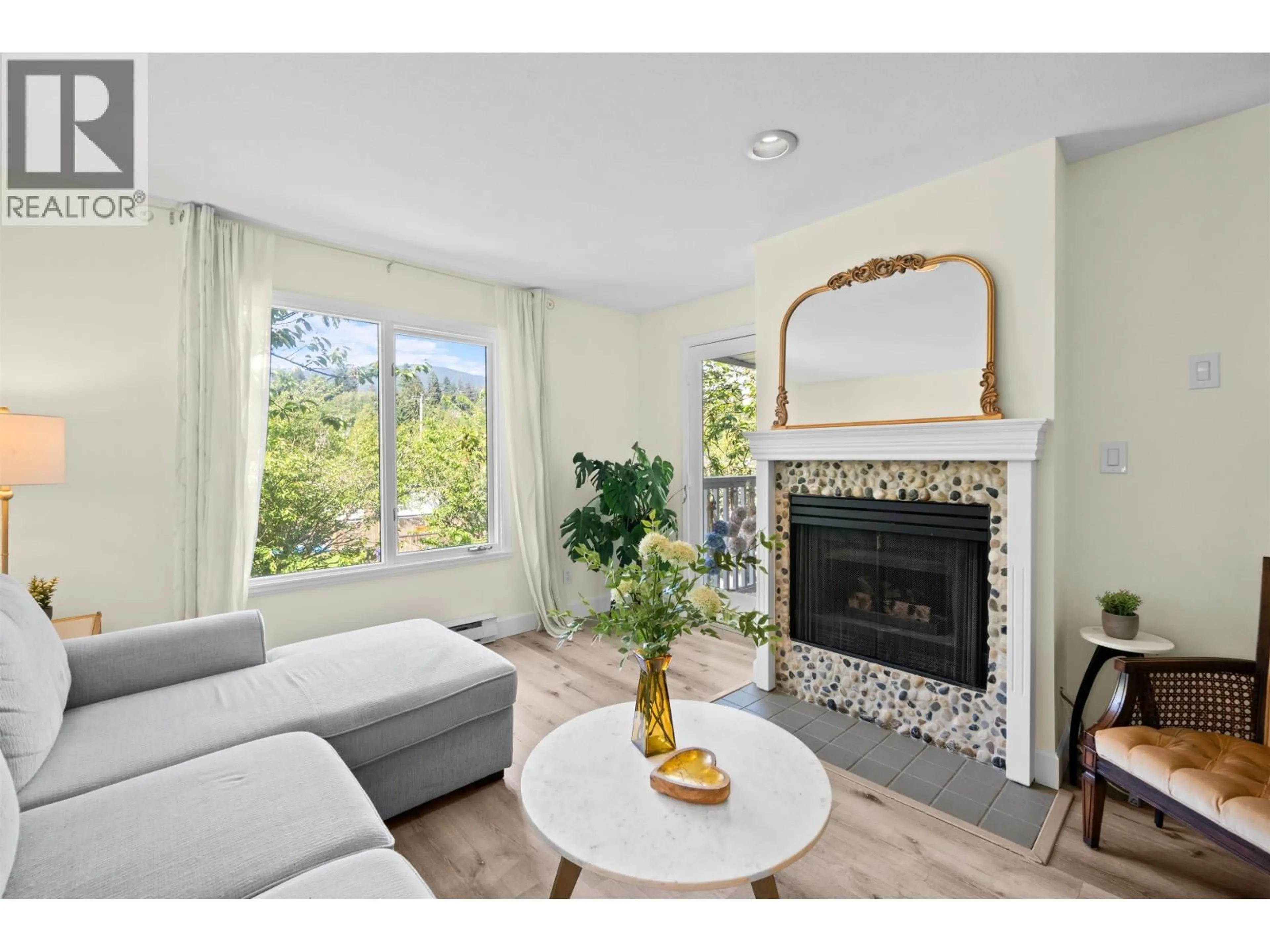 Living room with furniture, unknown for 204 - 1528 BOWSER AVENUE, North Vancouver British Columbia V7P2Y3