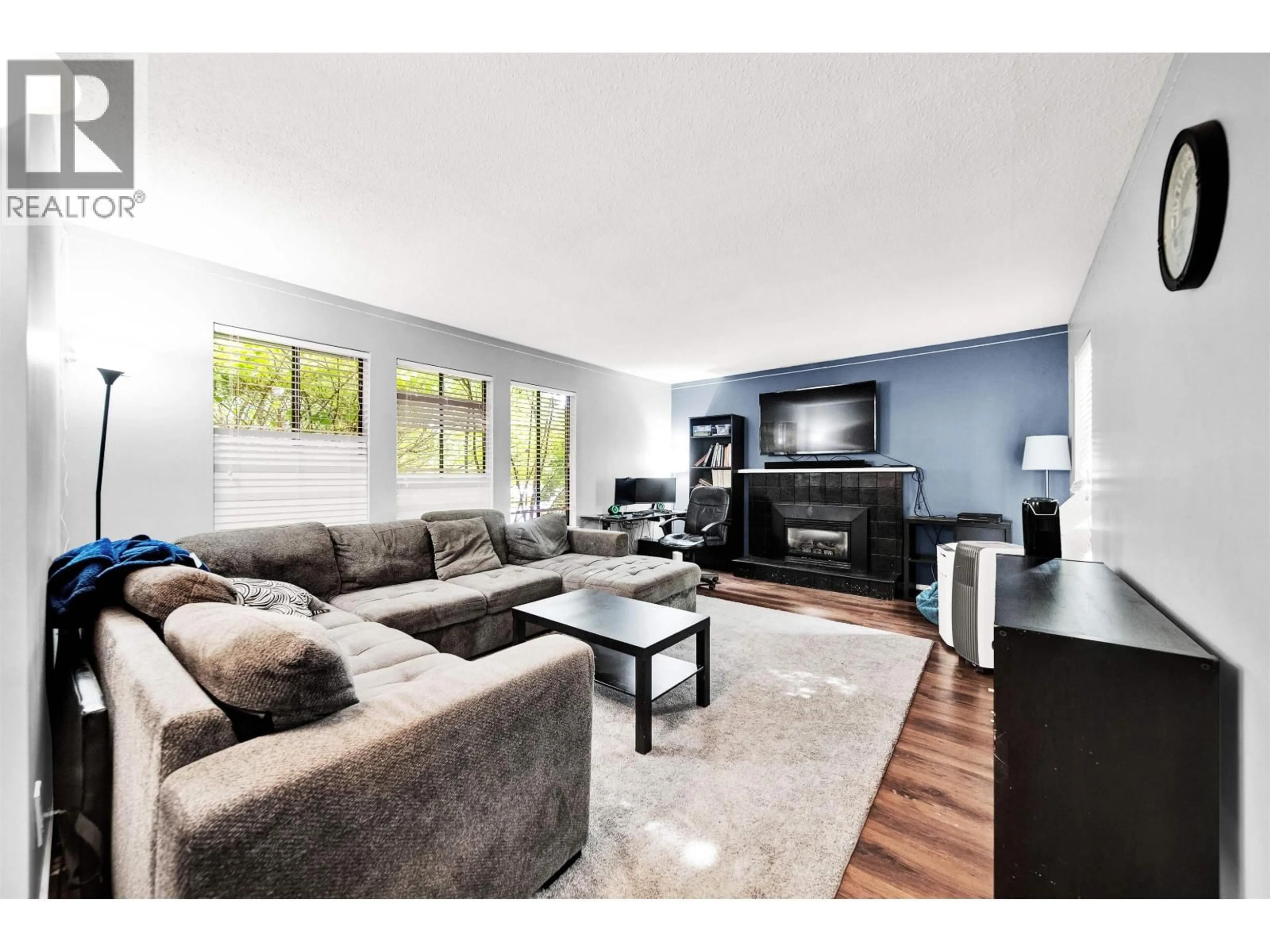 Living room with furniture, wood/laminate floor for 21022 123 AVENUE, Maple Ridge British Columbia V2X4B4