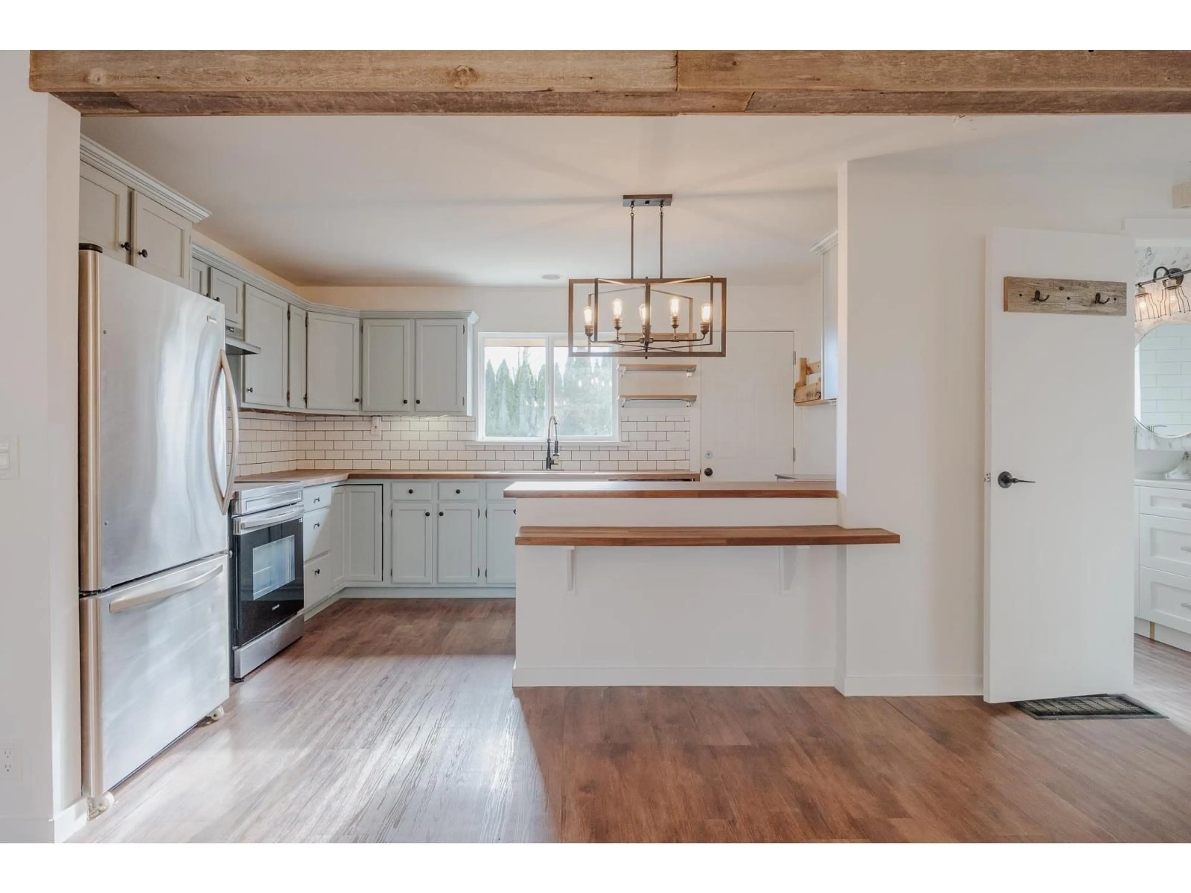 Open concept kitchen, wood/laminate floor for 35666 MOORE AVENUE, Mission British Columbia V2V7L6