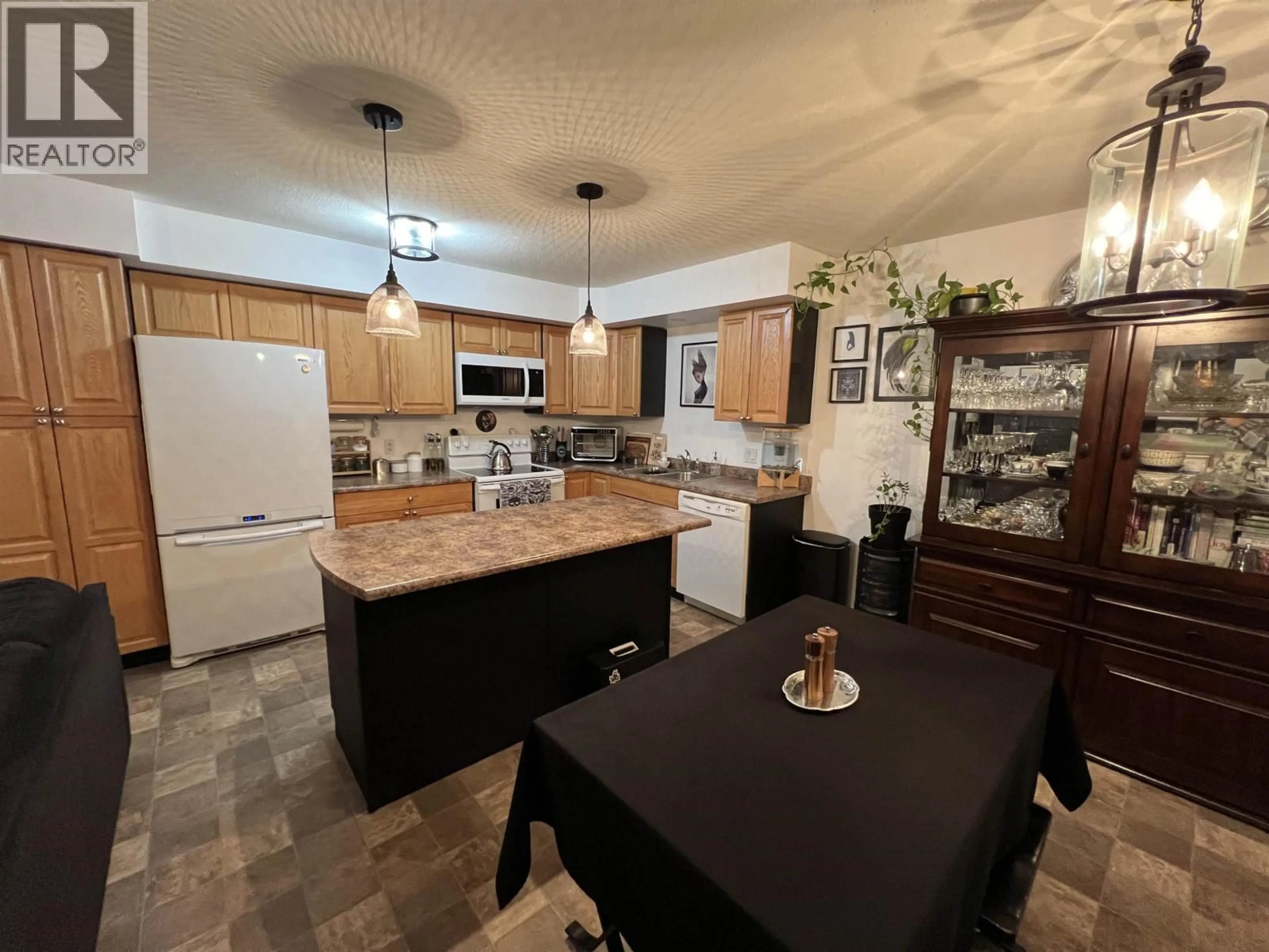Open concept kitchen, ceramic/tile floor for 7 - 4620 52 AVENUE, Fort Nelson British Columbia V0C1R0