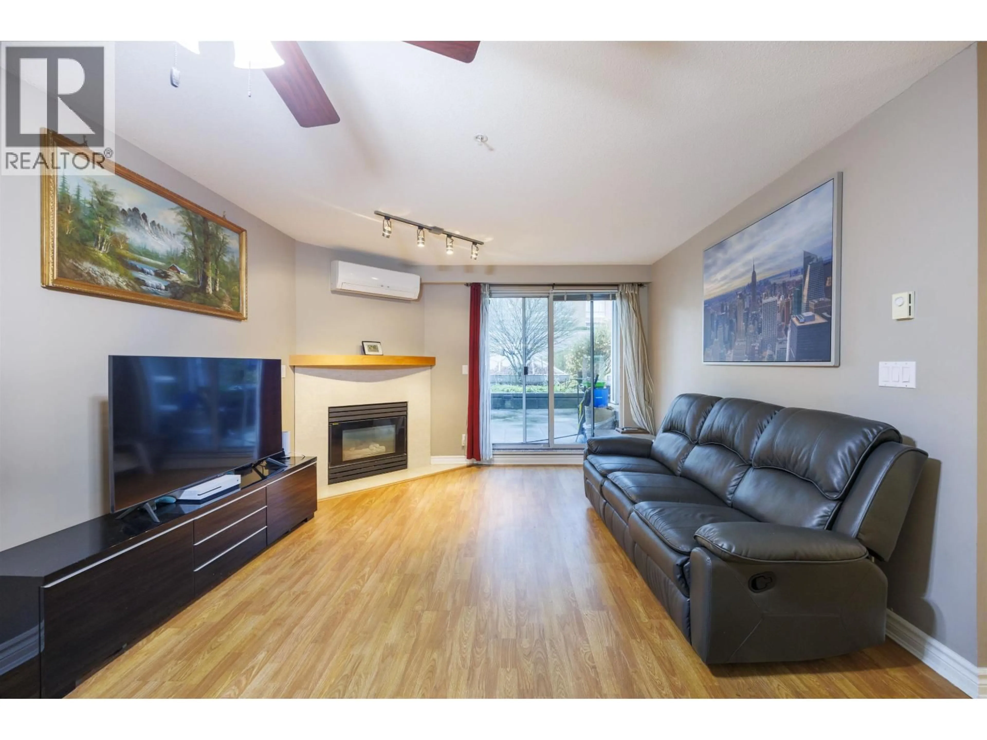 Living room with furniture, wood/laminate floor for 210 - 1163 THE HIGH STREET, Coquitlam British Columbia V3B7W2