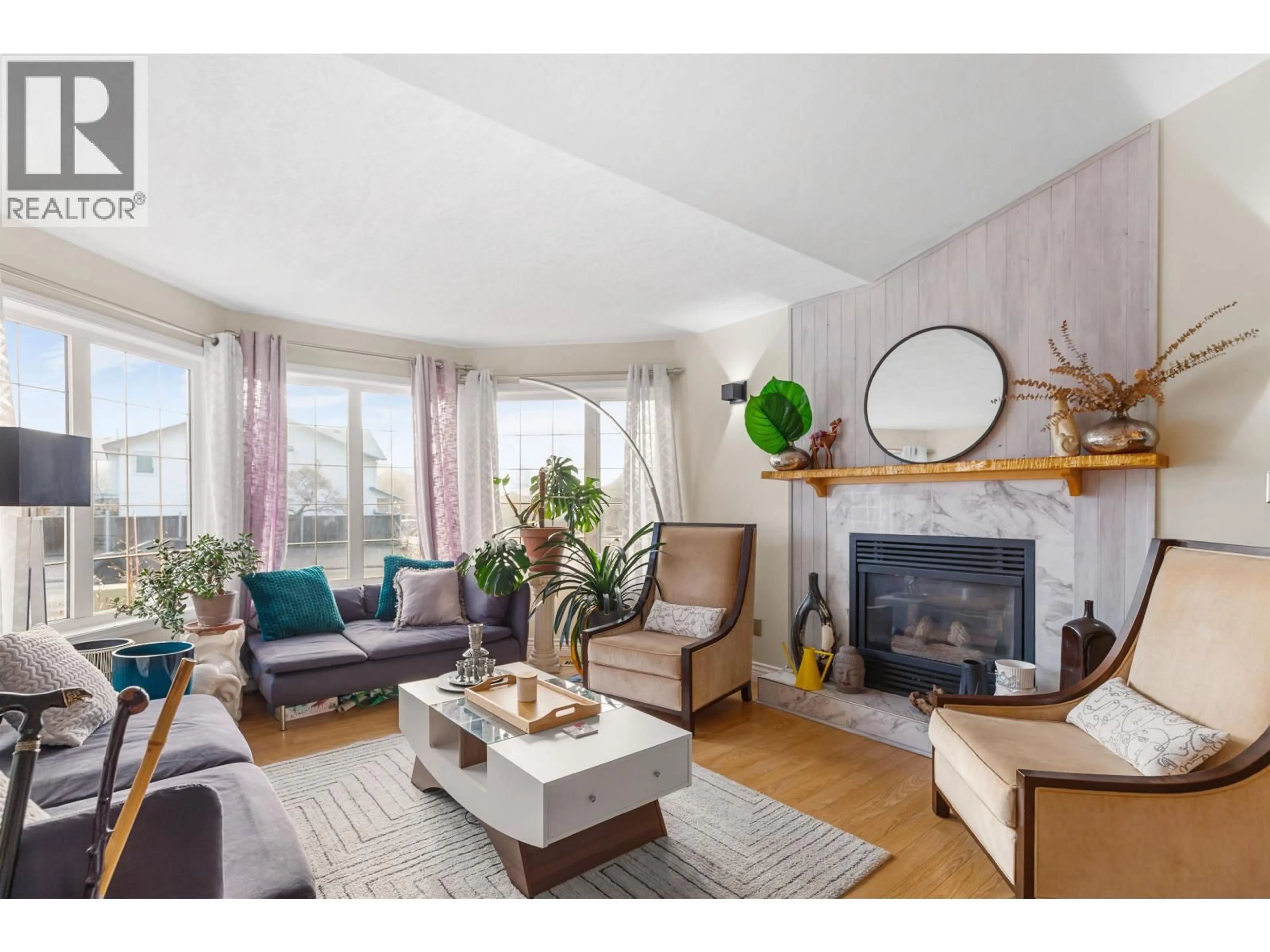 Living room with furniture, wood/laminate floor for 4436 STAUBLE ROAD, Prince George British Columbia V2K4X3