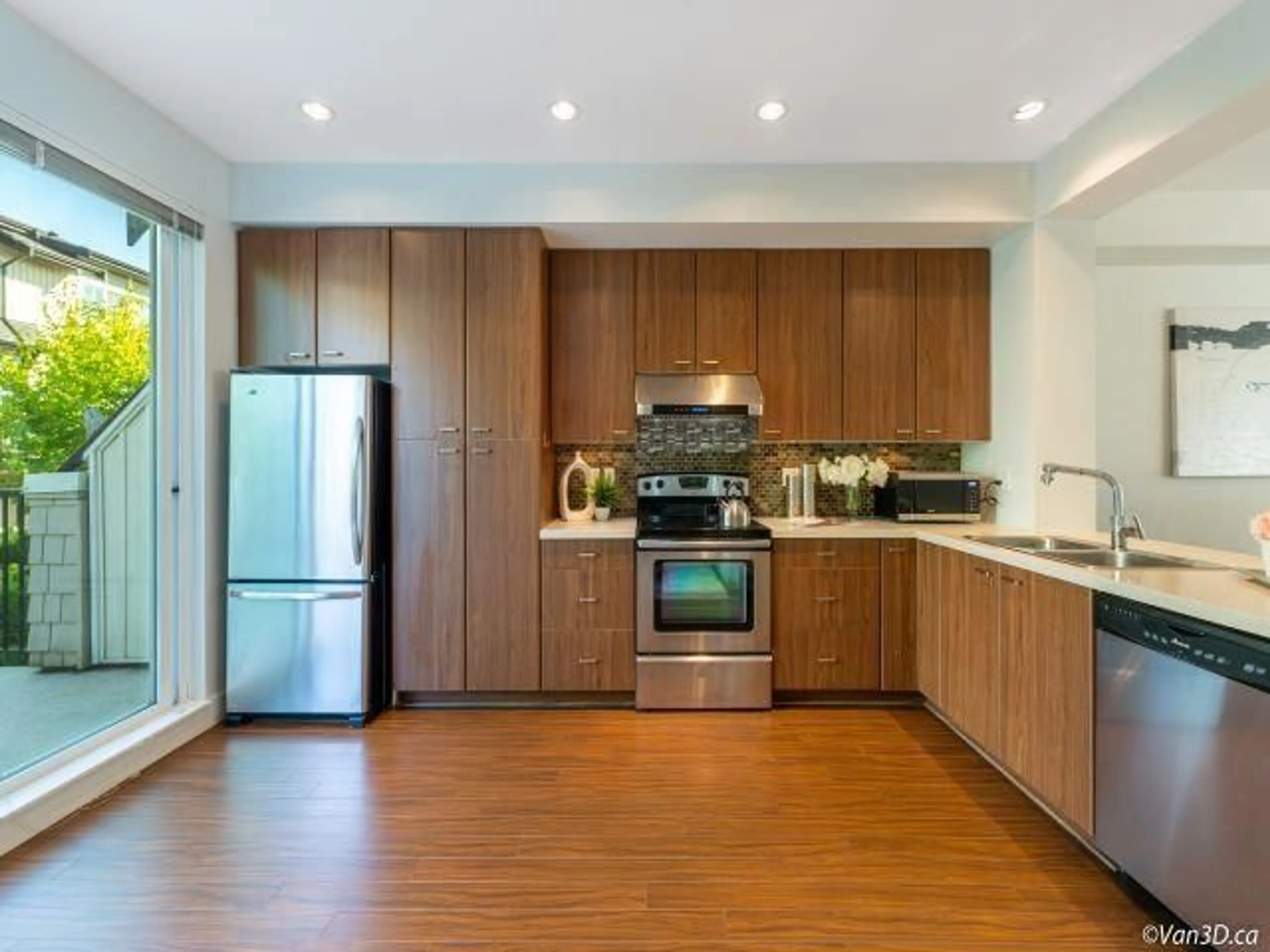 Open concept kitchen, wood/laminate floor for 143 - 2450 161A STREET, Surrey British Columbia V3Z8K4