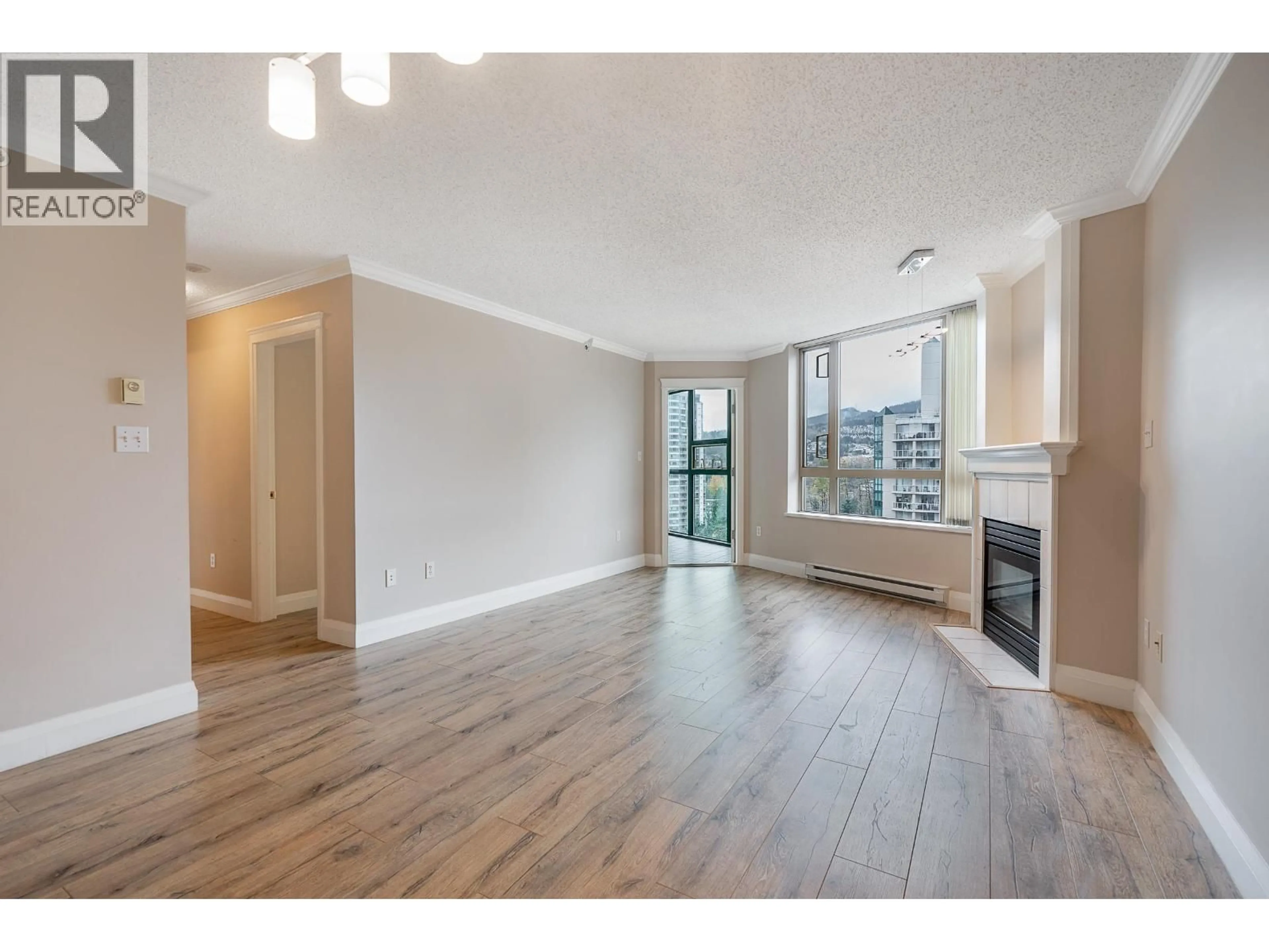 Living room with furniture, wood/laminate floor for 1305 - 1190 PIPELINE ROAD, Coquitlam British Columbia V3B7T9