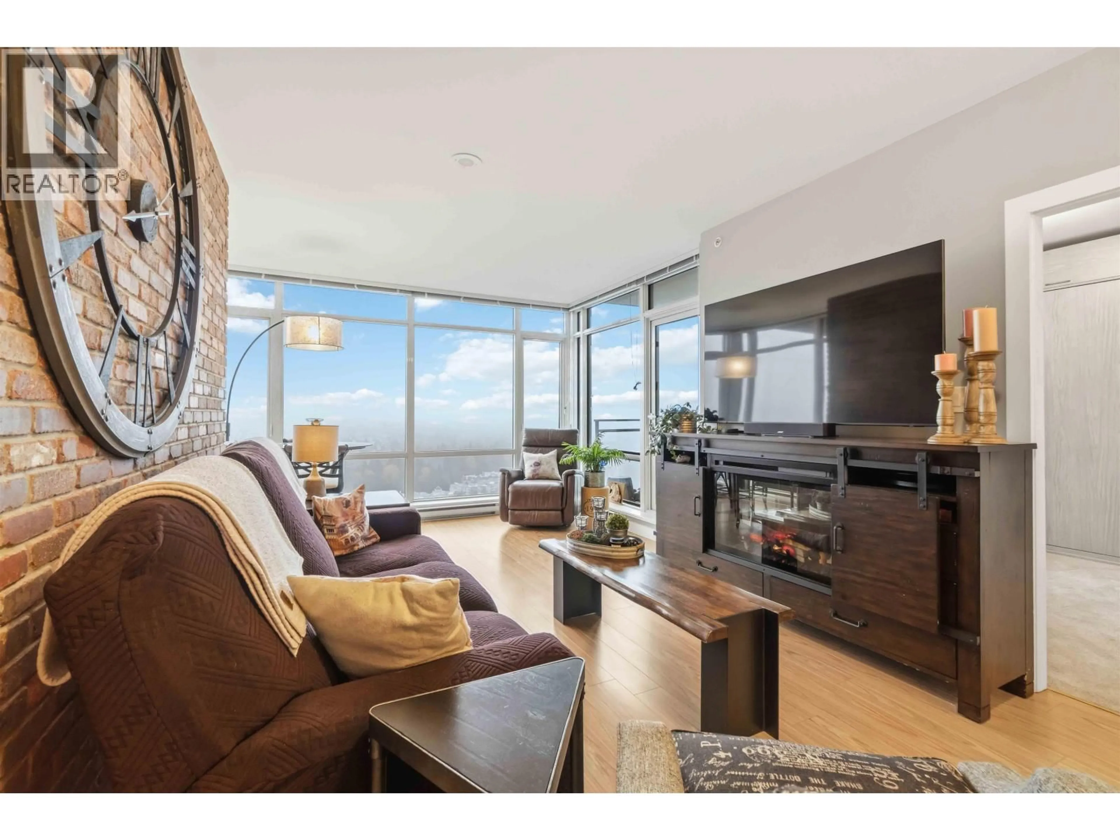 Living room with furniture, wood/laminate floor for 3901 - 2955 ATLANTIC AVENUE, Coquitlam British Columbia V3B0H9