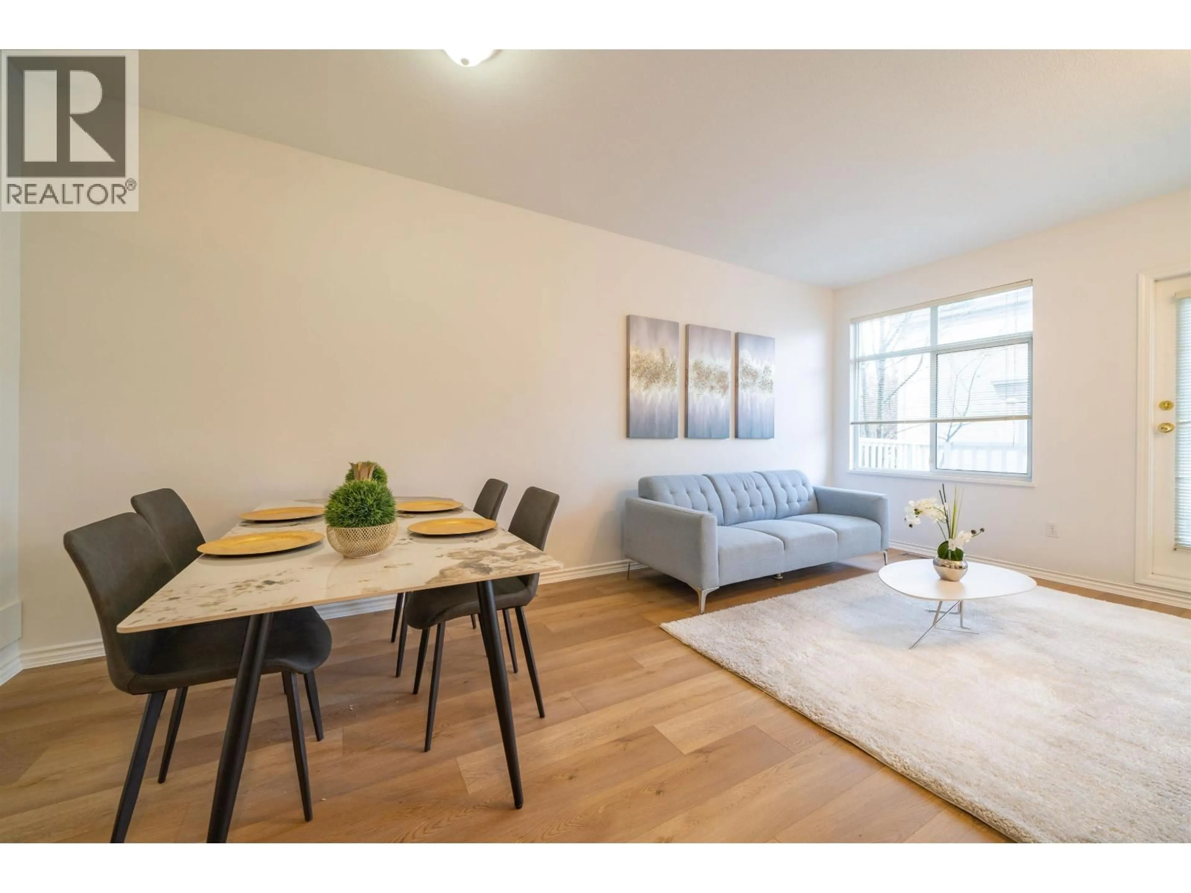 Living room with furniture, wood/laminate floor for 30 - 6179 NO. 1 ROAD, Richmond British Columbia V7C1T4